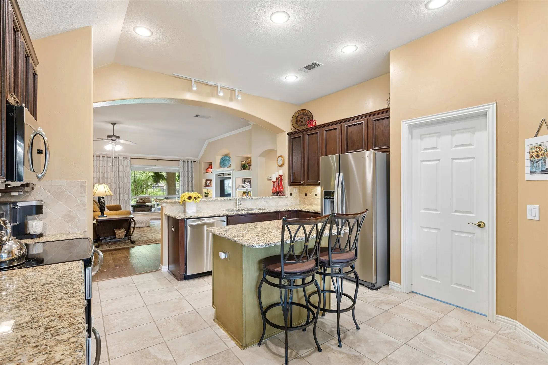 Kitchen offers easy access to laundry room and garage entry