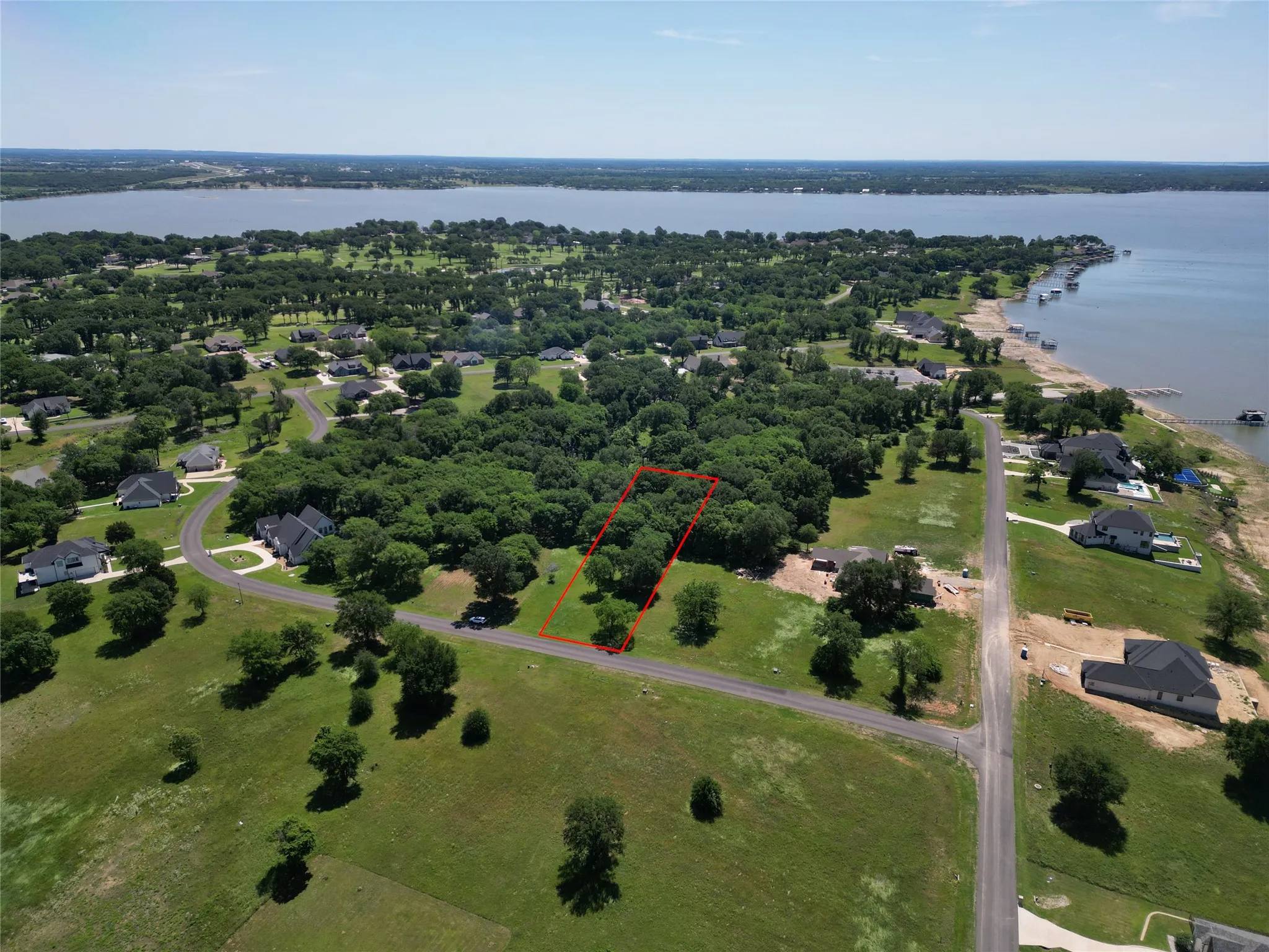 Aerial perspective showcasing a lakefront community with a prominent lake