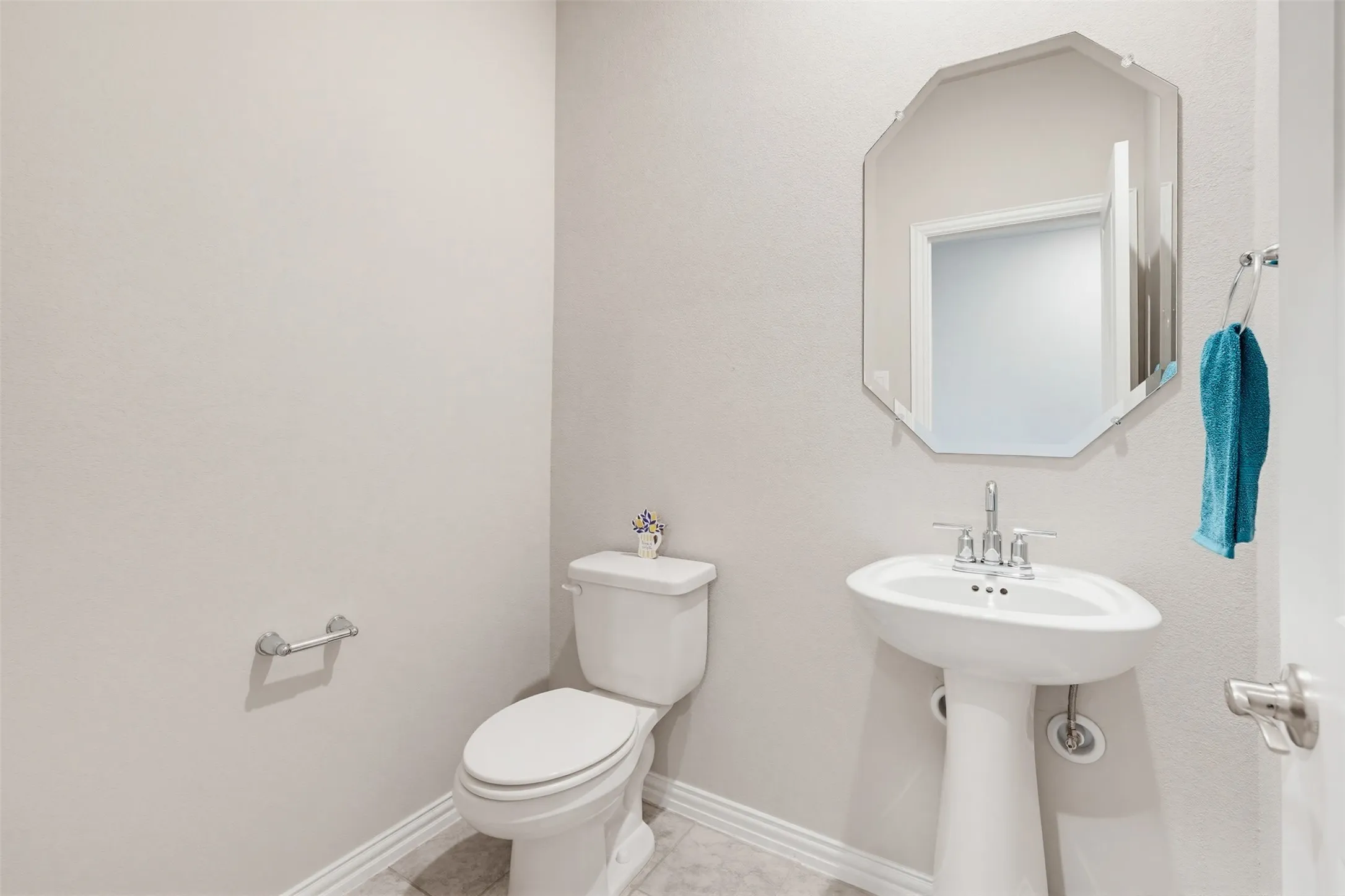 Convenient downstairs half bath for guests, located off the main living areas.