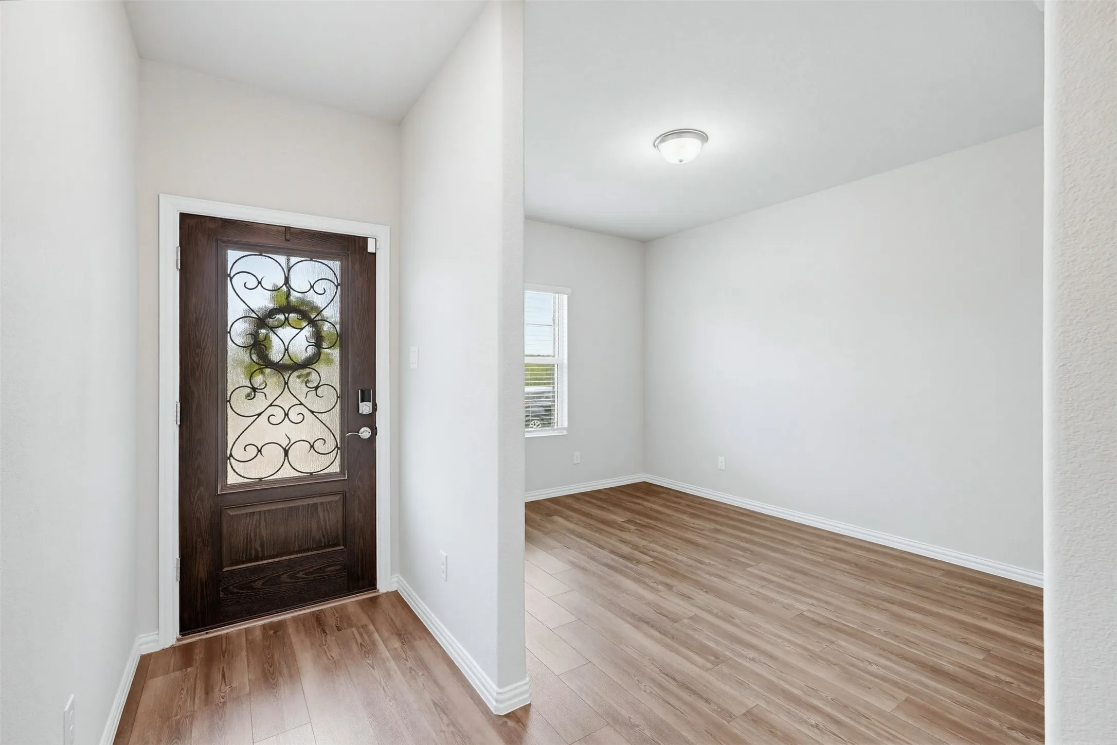 Welcoming entry with freshly painted walls and a bright, clean feel, leading into an open concept layout ideal for everyday living.