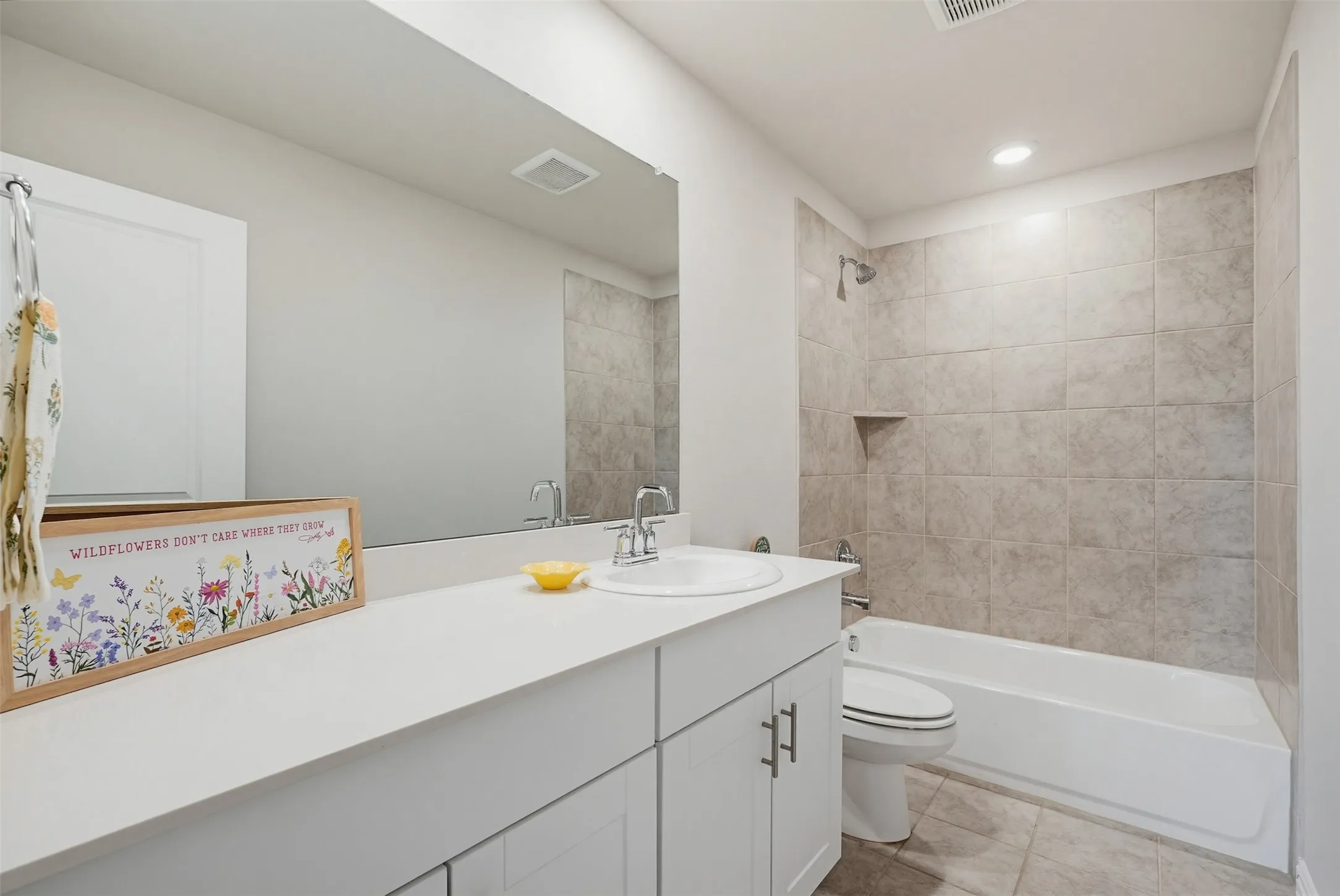 Upstairs full bathroom conveniently located near secondary bedrooms and game room.