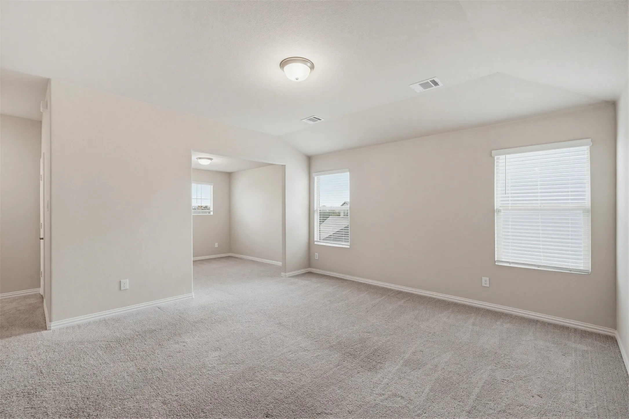Spacious upstairs game room offering flexible space for entertainment, play, or a second living area.