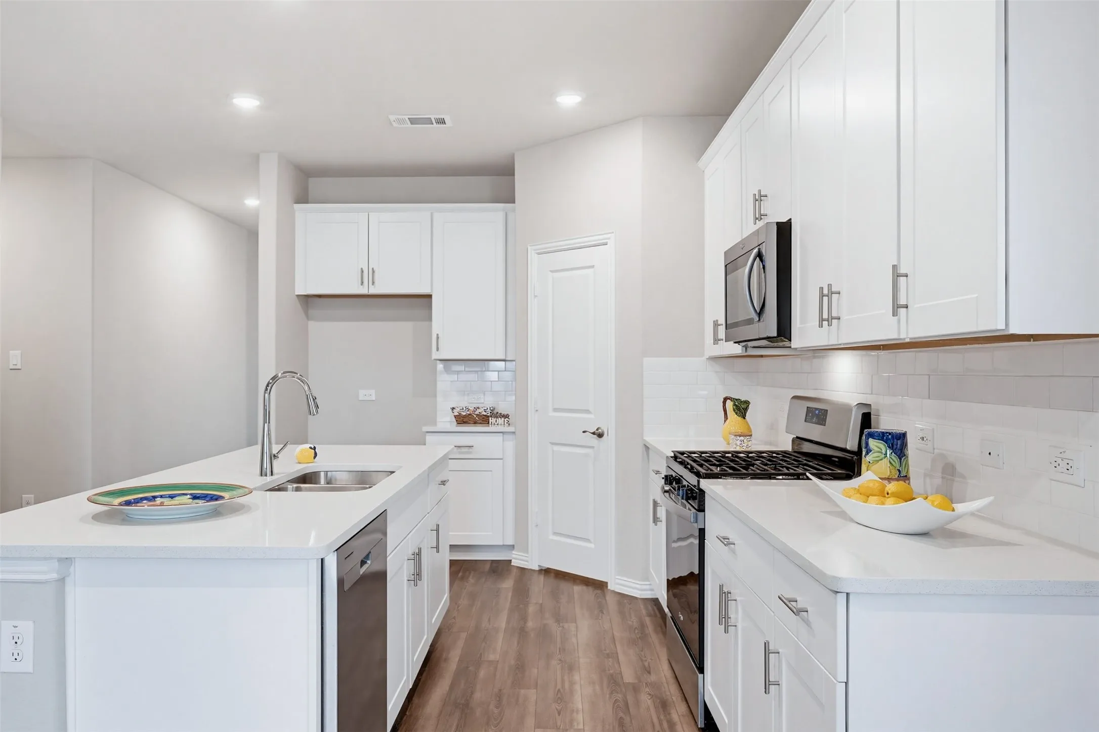Modern kitchen with open layout overlooking the living and dining areas, ideal for hosting and staying connected.