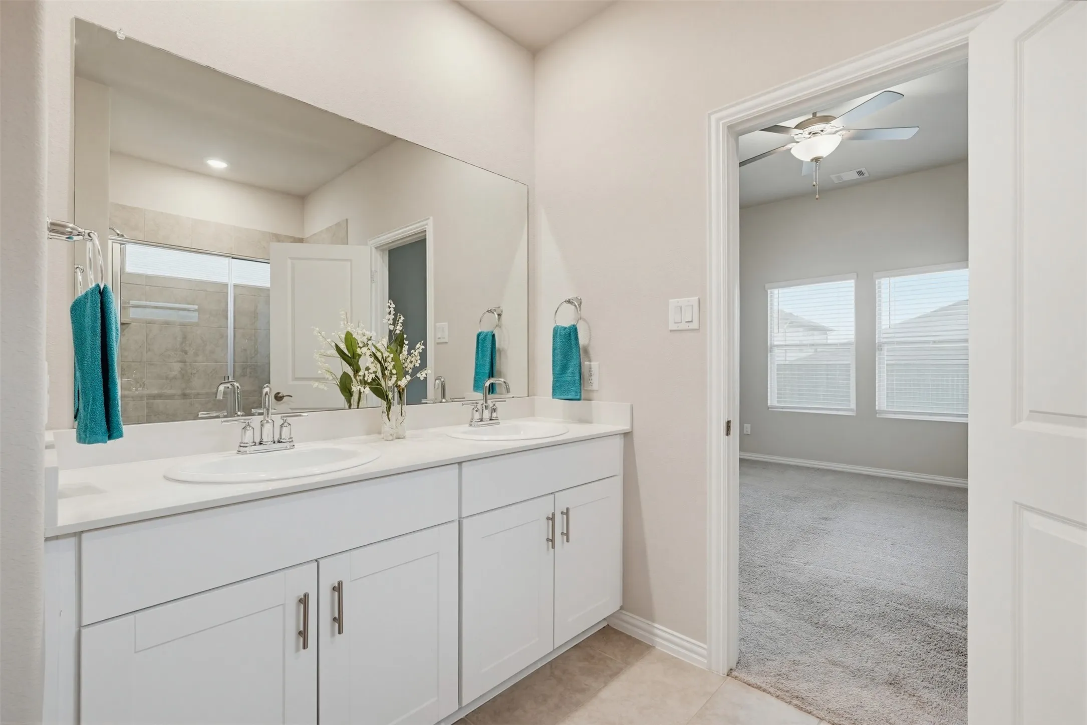 Primary bathroom featuring functional layout and plenty of space for daily routines.