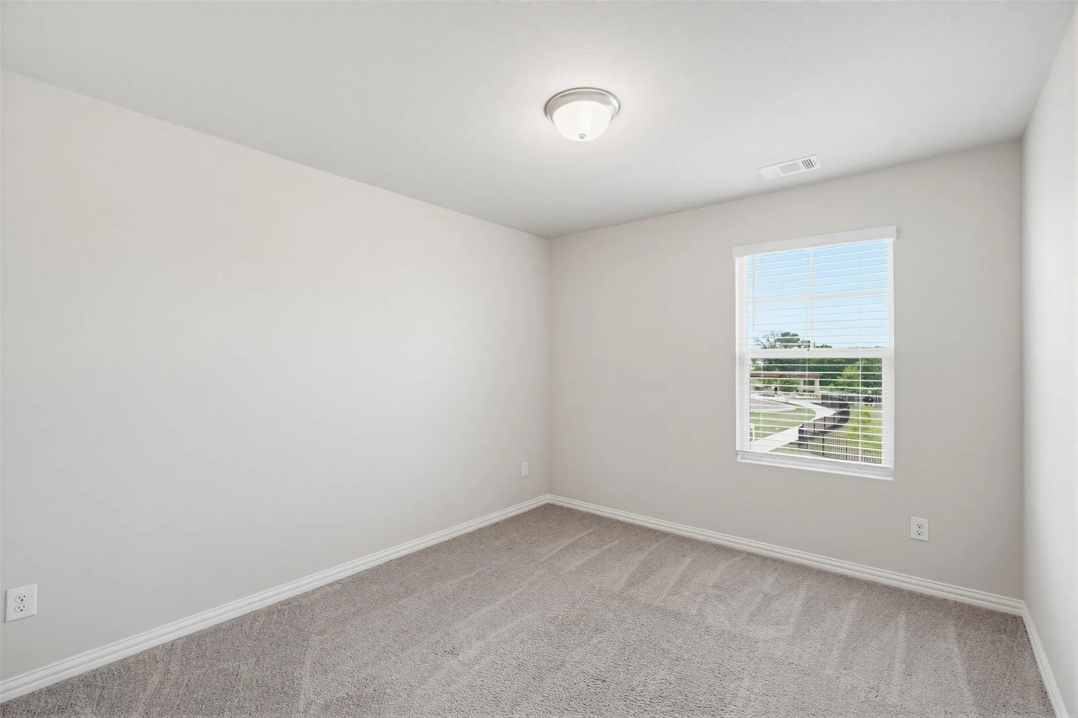 Additional upstairs bedroom with flexible use for guests, office, or hobbies.