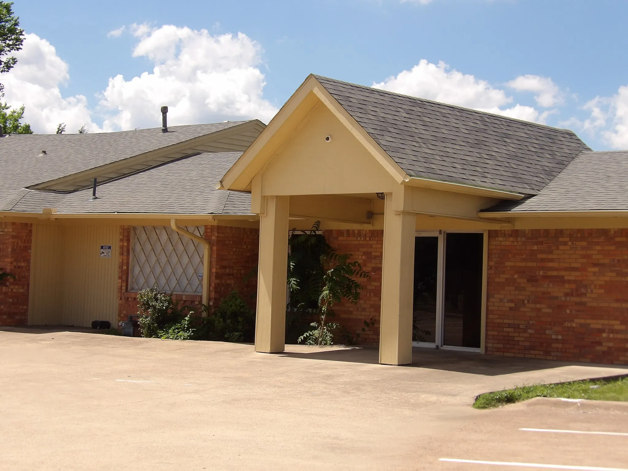 Brick exterior with a covered entryway