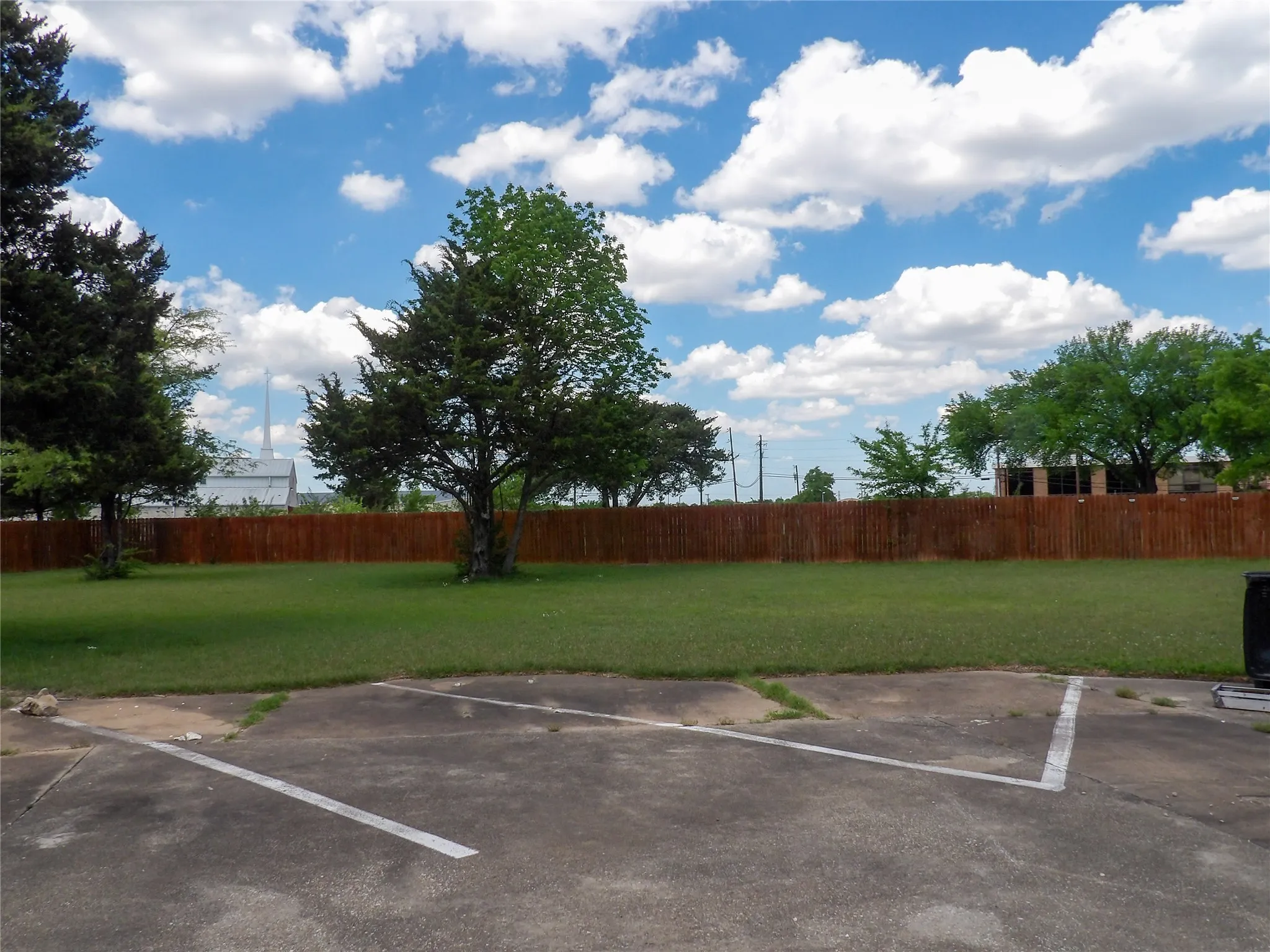 Rear view of 1 acre with additional parking space