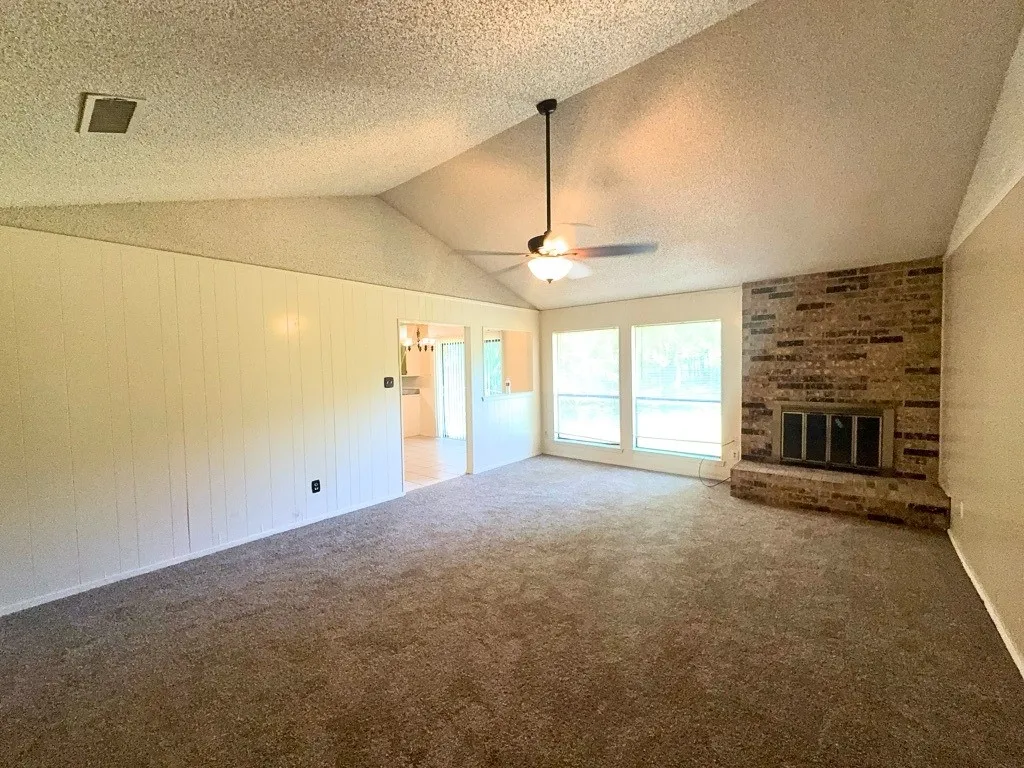 Vaulted ceiling with brick fireplace