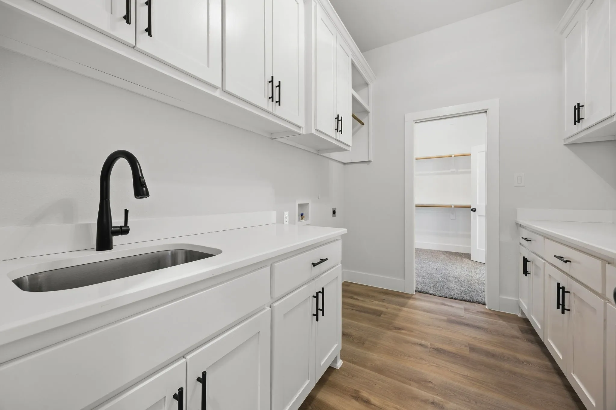 White cabinetry with matte black hardware