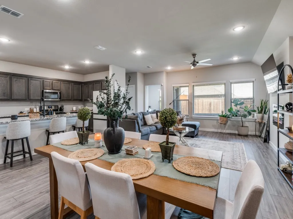 Open-concept living space featuring wood-finish flooring throughout