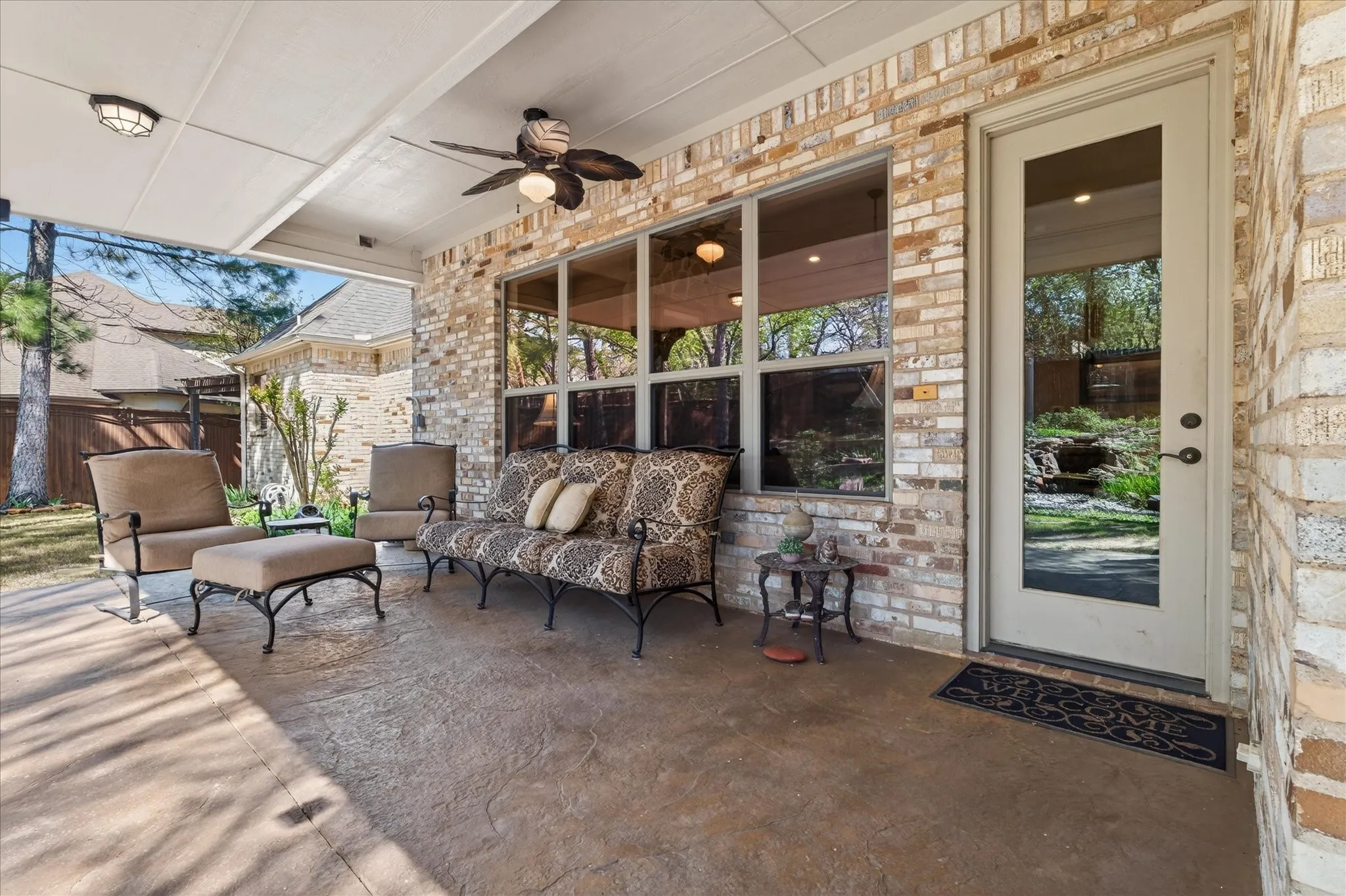 Covered patio featuring a ceiling fan, recessed lighting, and a stamped concrete floor