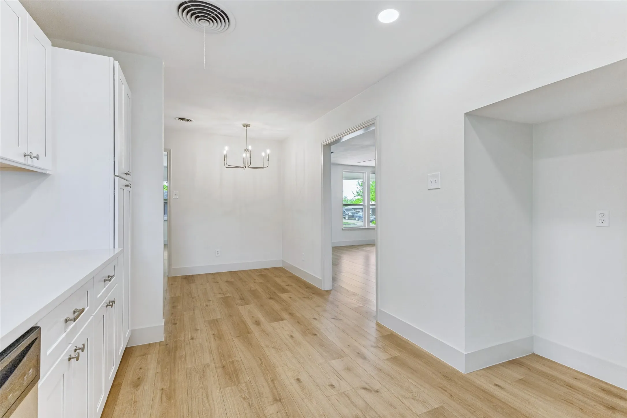 Modern interior with wood-finish flooring throughout