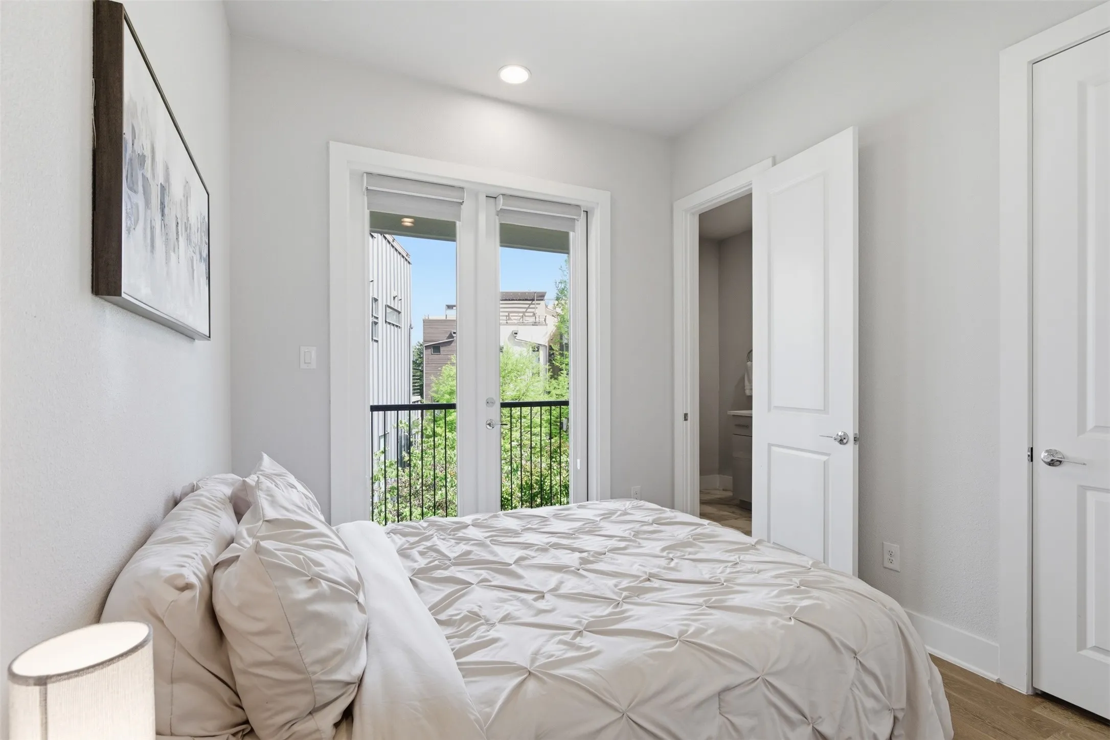 3rd floor: Treelined Balcony #2 in secondary bedroom ideal for home office/guest room for visiting family.
