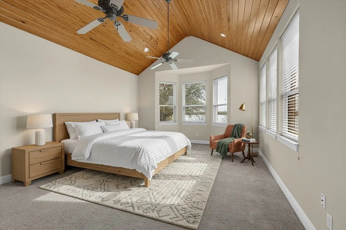 Vaulted wood-paneled ceiling featuring recessed lighting and ceiling fans