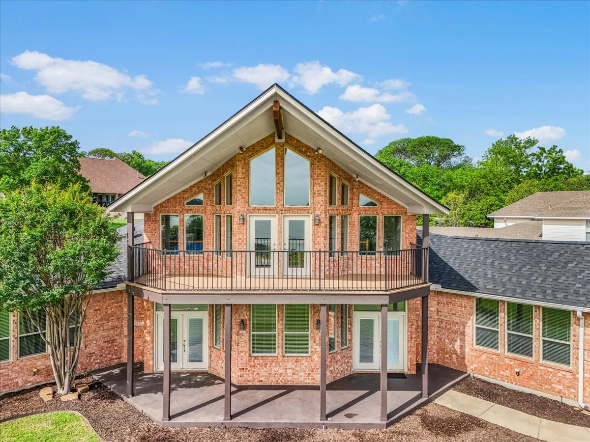 Brick exterior with a prominent two-story A-frame design