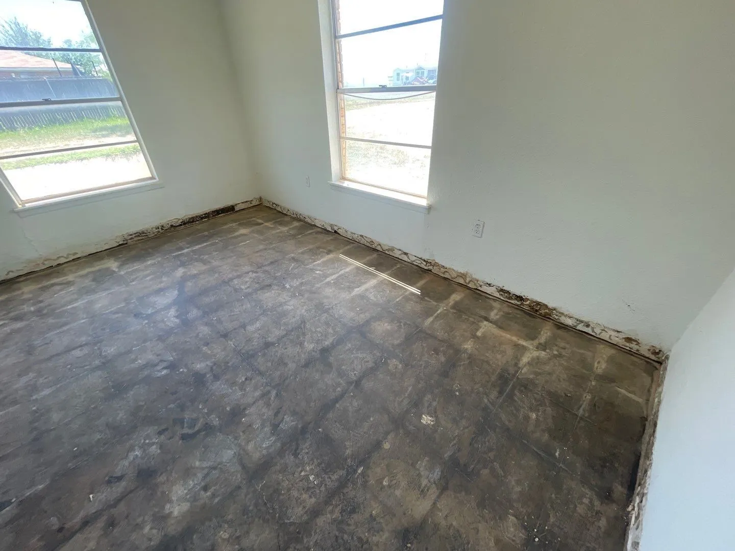 One of 16 rooms not damaged by roof  leak--just needs new flooring