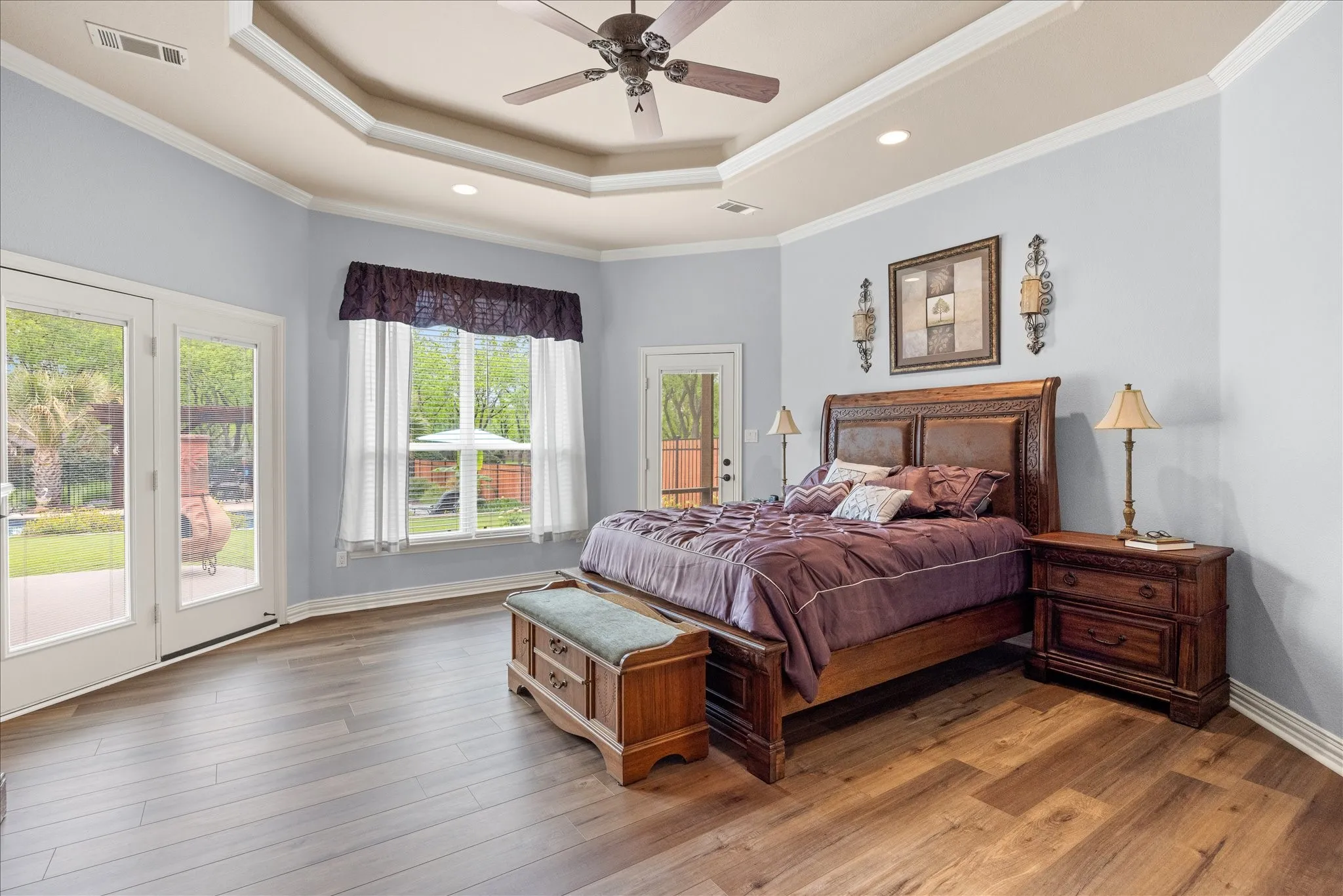 Primary bedroom is spacious with lots of natural light and has a private screened in patio.