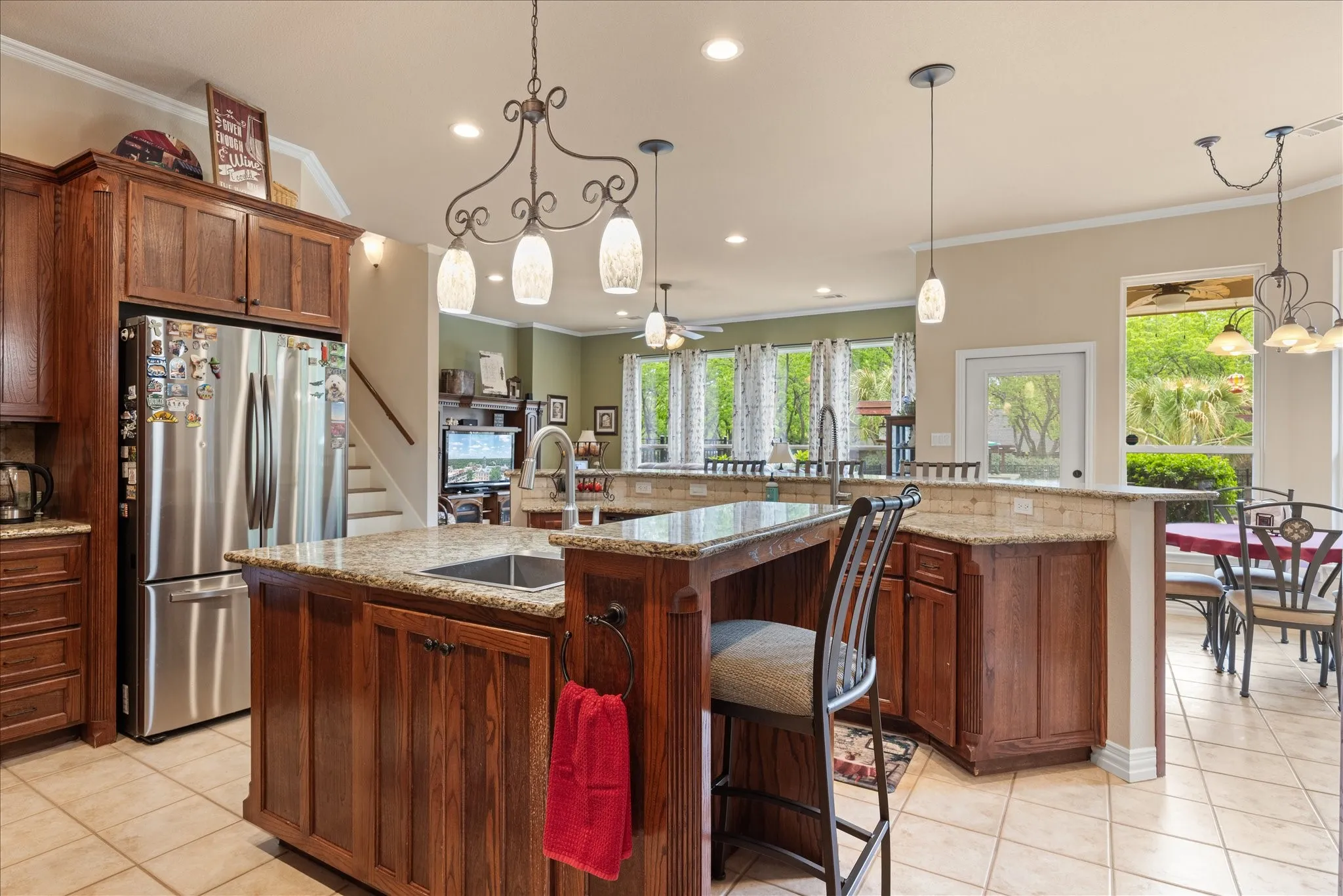 Kitchen opens up to living room and dining room with lots of natural lighting.