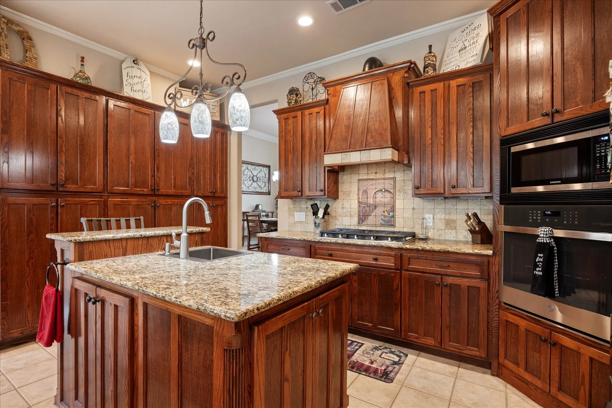 Large kitchen island and gas cooktop.