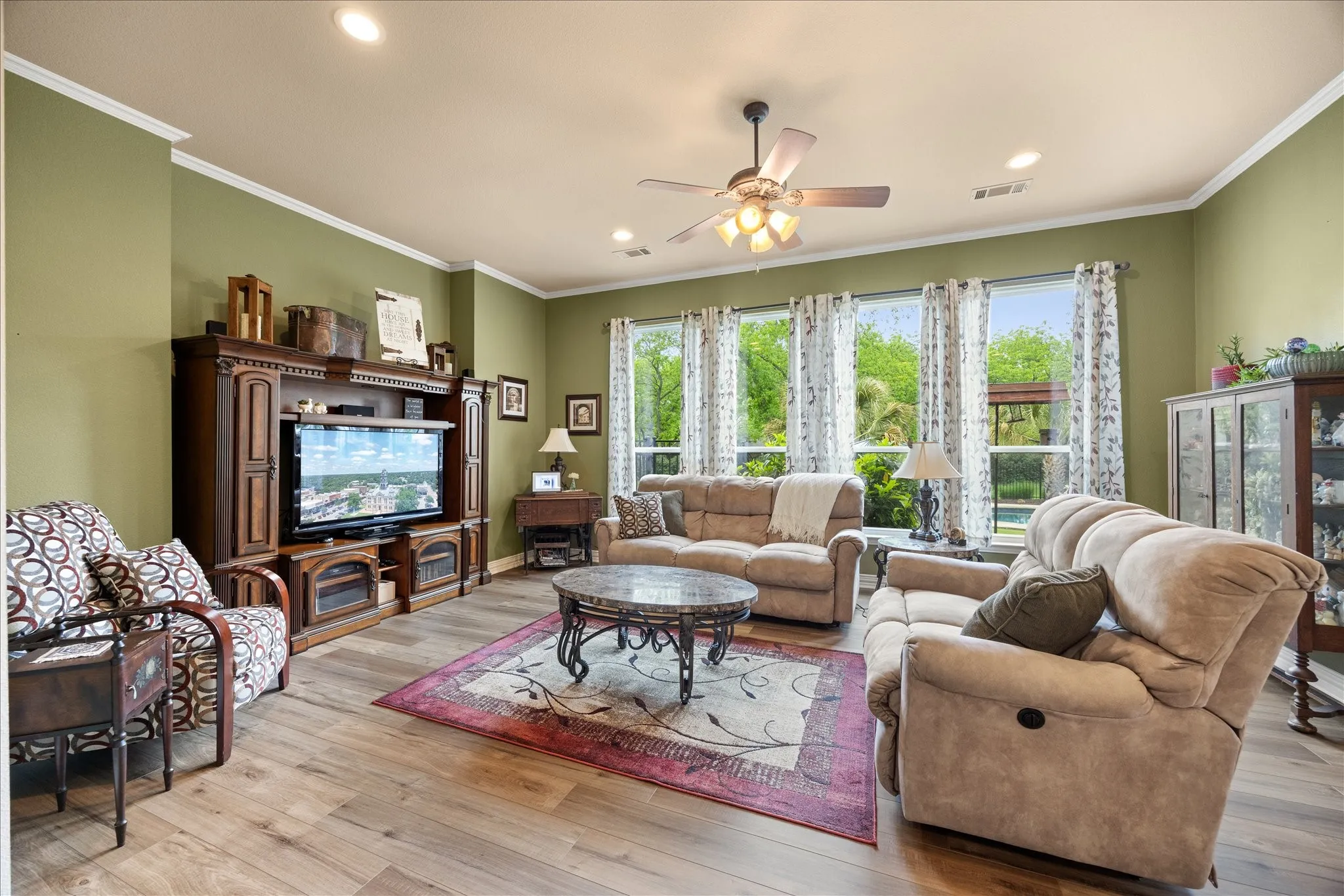 Large family room opens up to the kitchen and features luxury vinyl plank floors.