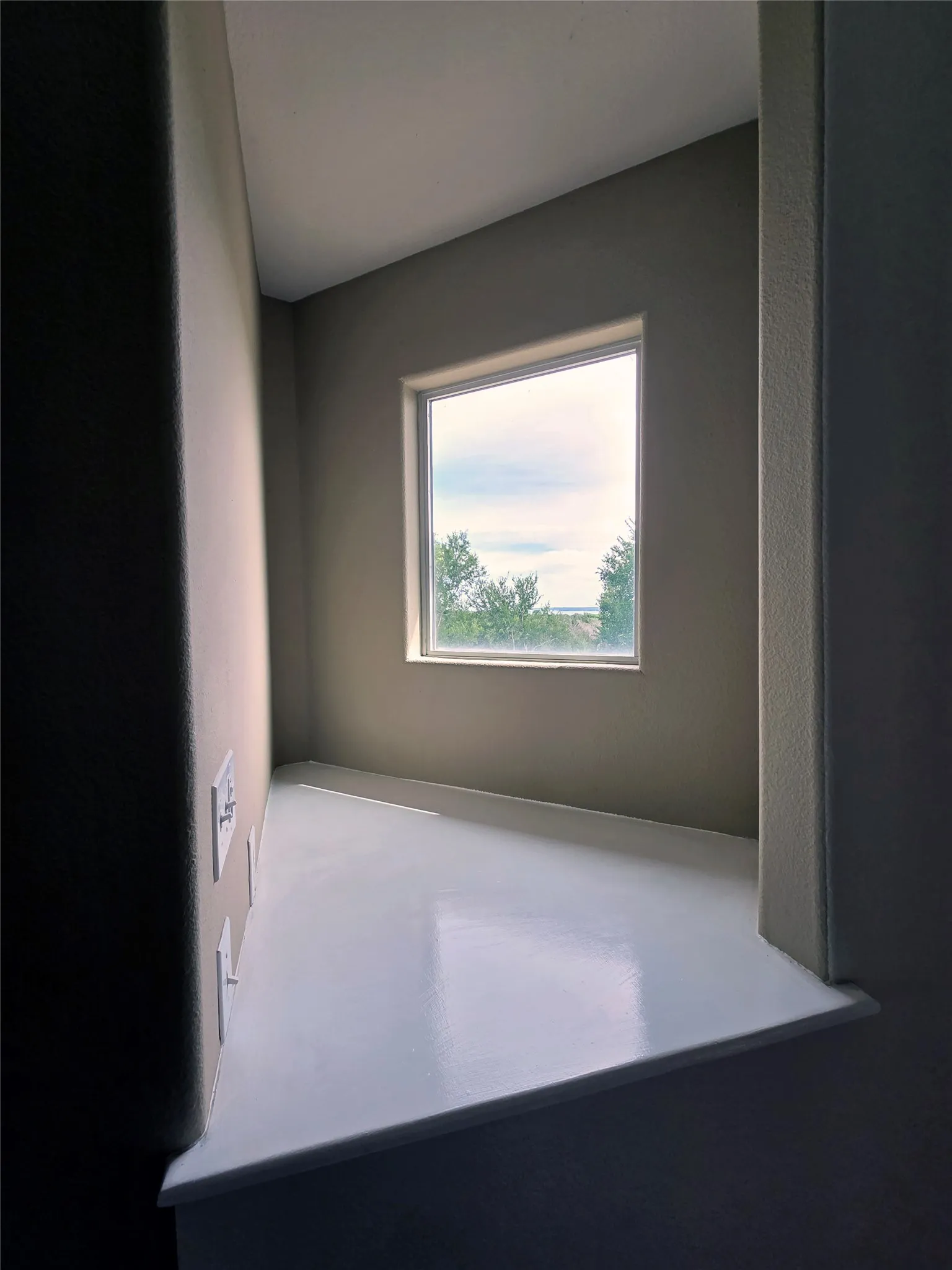 3rd floow stairwell window with partial lake view