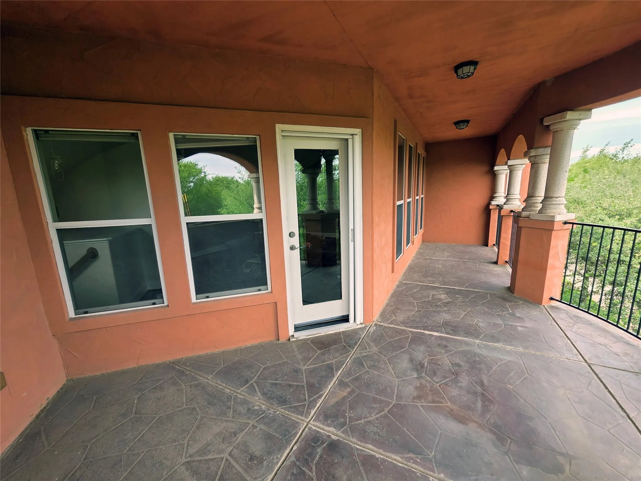 oversized 3rd floor balcony with partial lake view