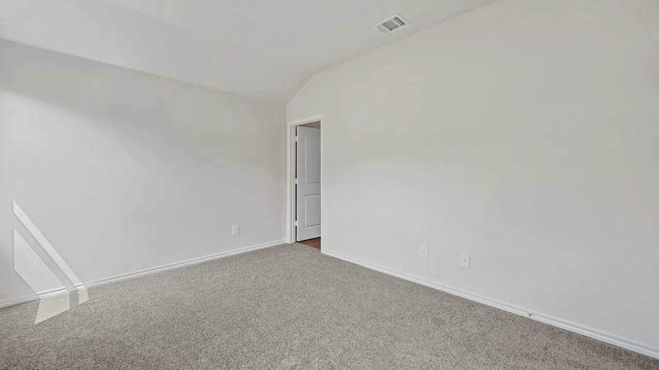 Neutral paint palette with vaulted ceilings and light gray carpet