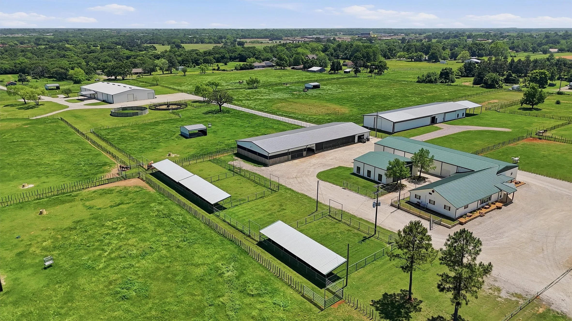 Aerial view showing turn out lots with cover to the east of residence and Show Barn