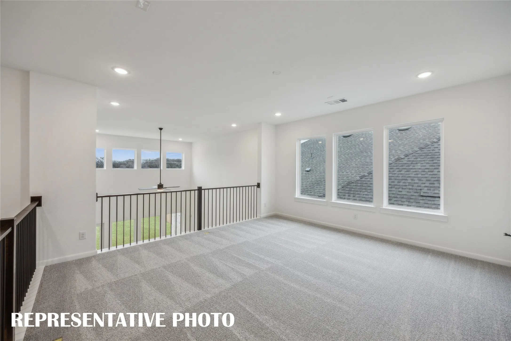 The light and bright family room with adjacent media room create the ultimate family entertainment zone!  REPRESENTATIVE PHOTO