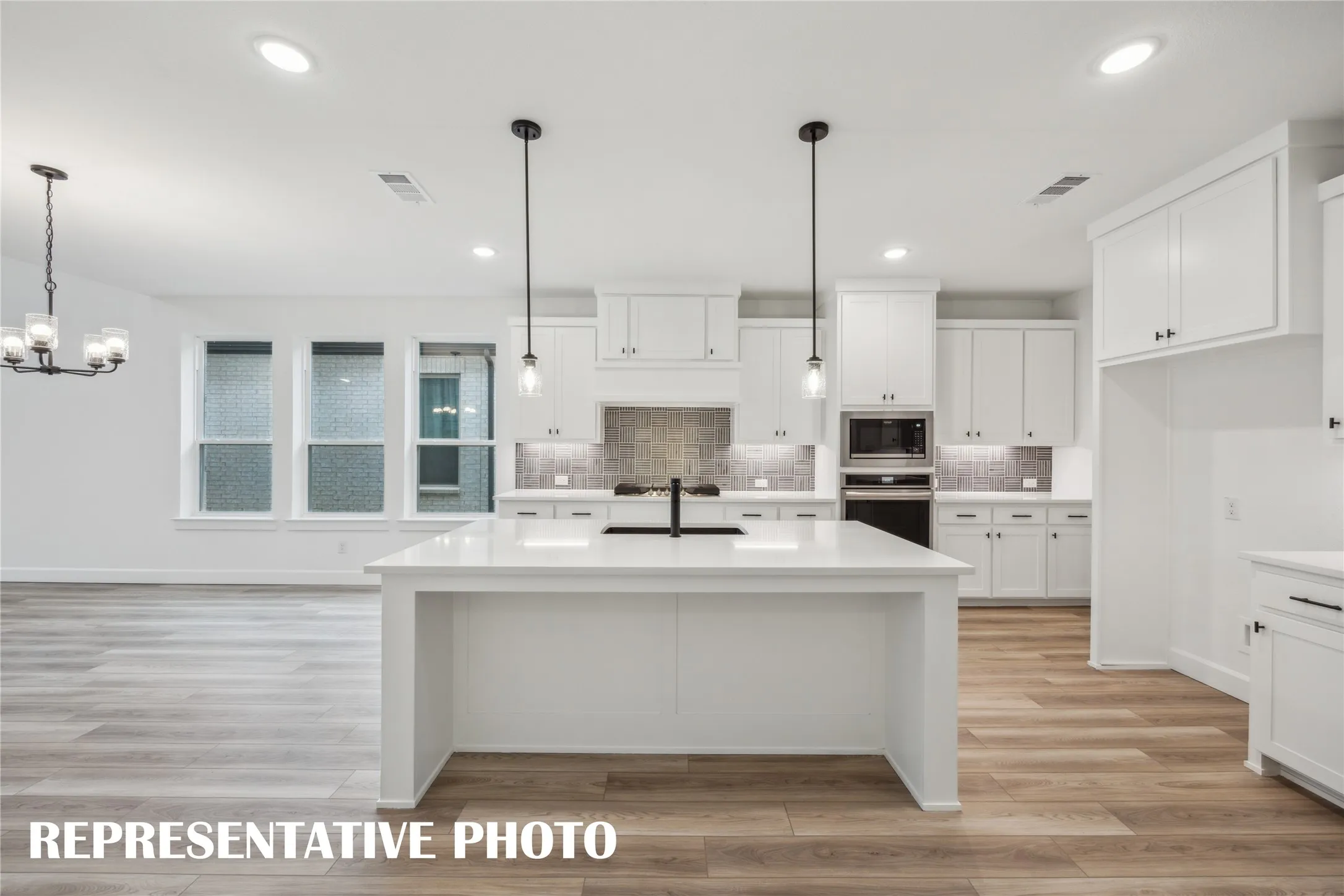 Featuring outstanding space, storage and style, this dream kitchen has it all!  REPRESENTATIVE PHOTO