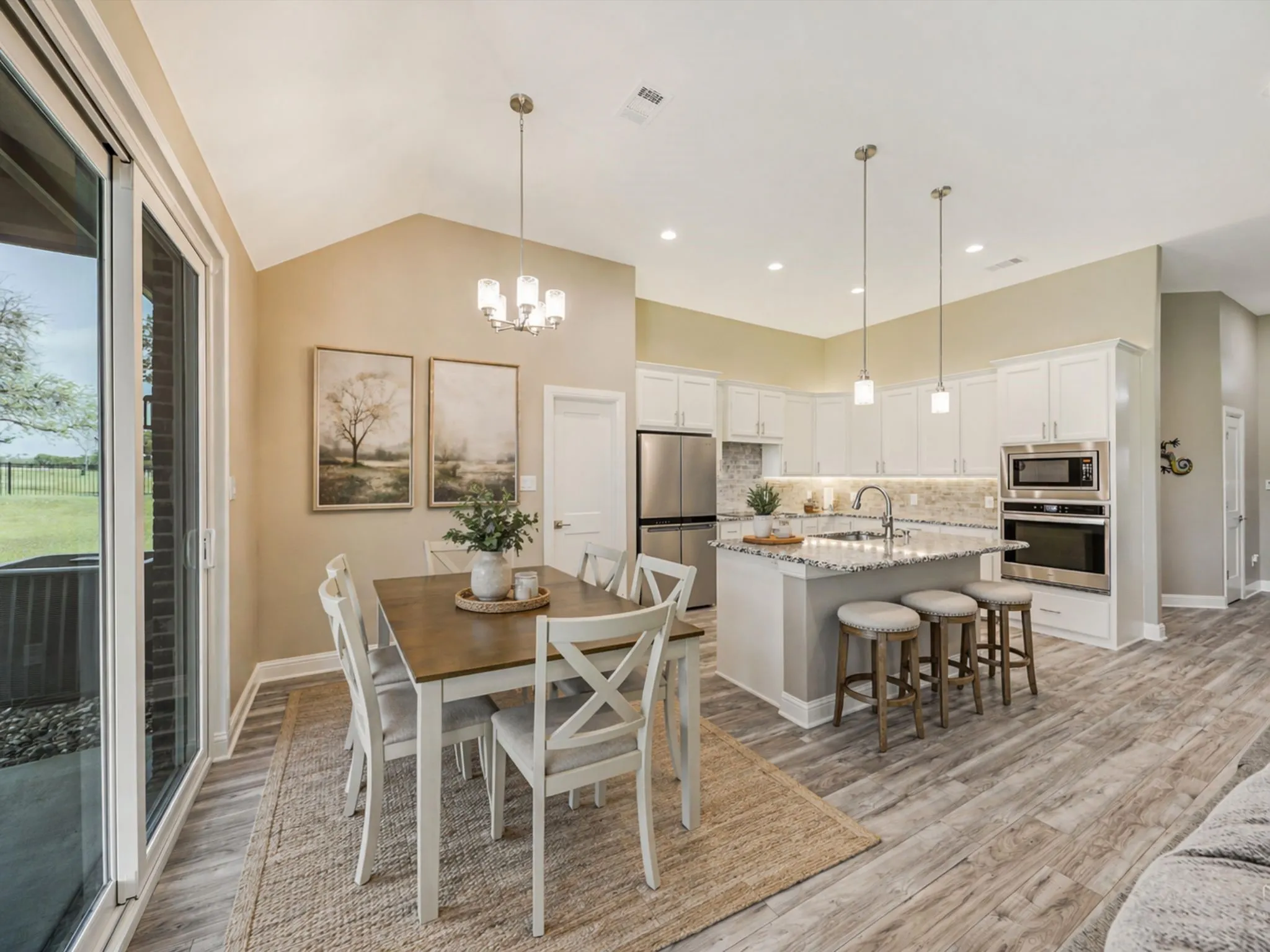 Designed for connection, this open kitchen and dining area makes everyday living and entertaining feel effortless. Bright finishes and thoughtful touches create a space that feels both welcoming and elevated.
