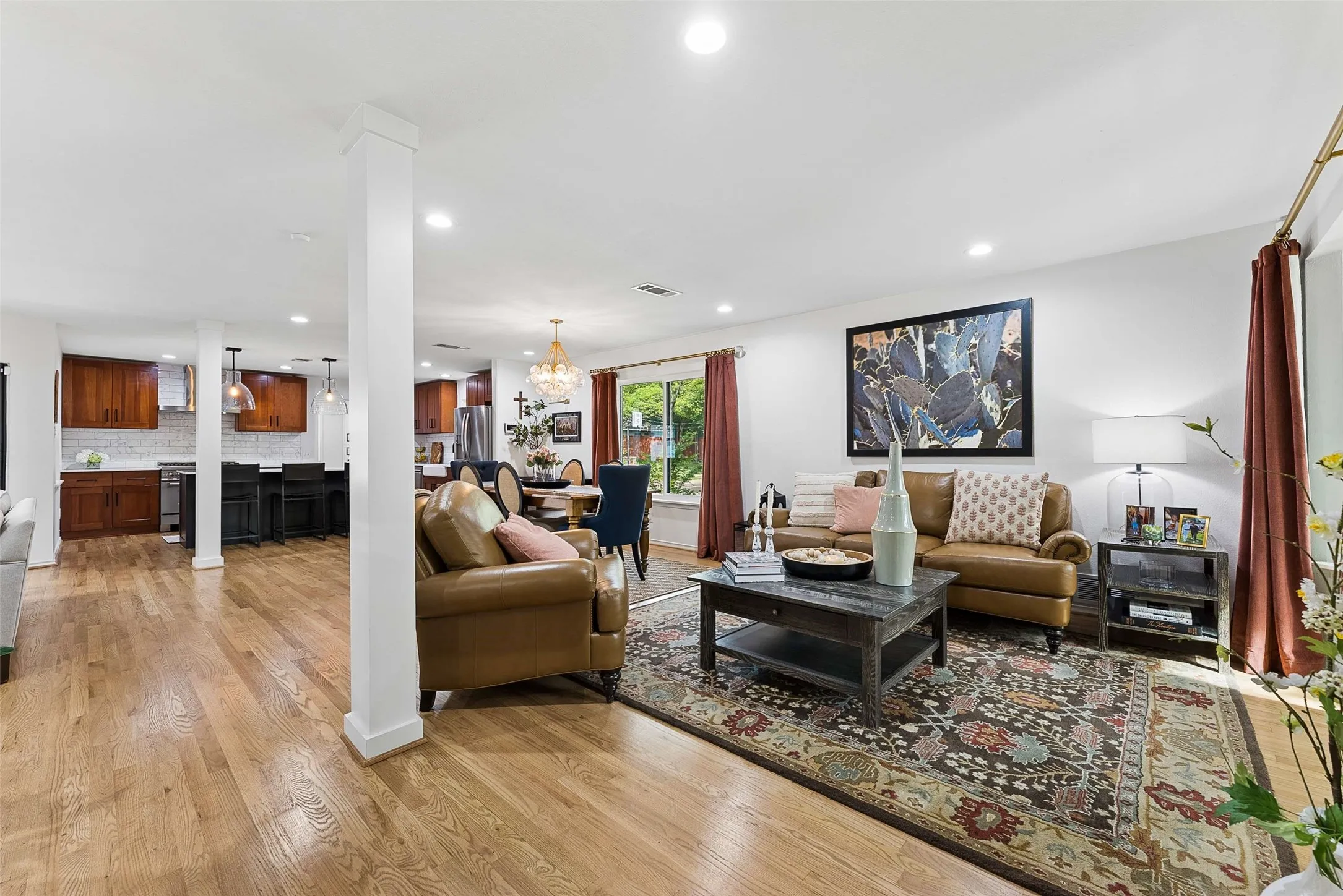 From front entry. Large Living, Dining, and Chef's Kitchen! Hardwood floors throughout.