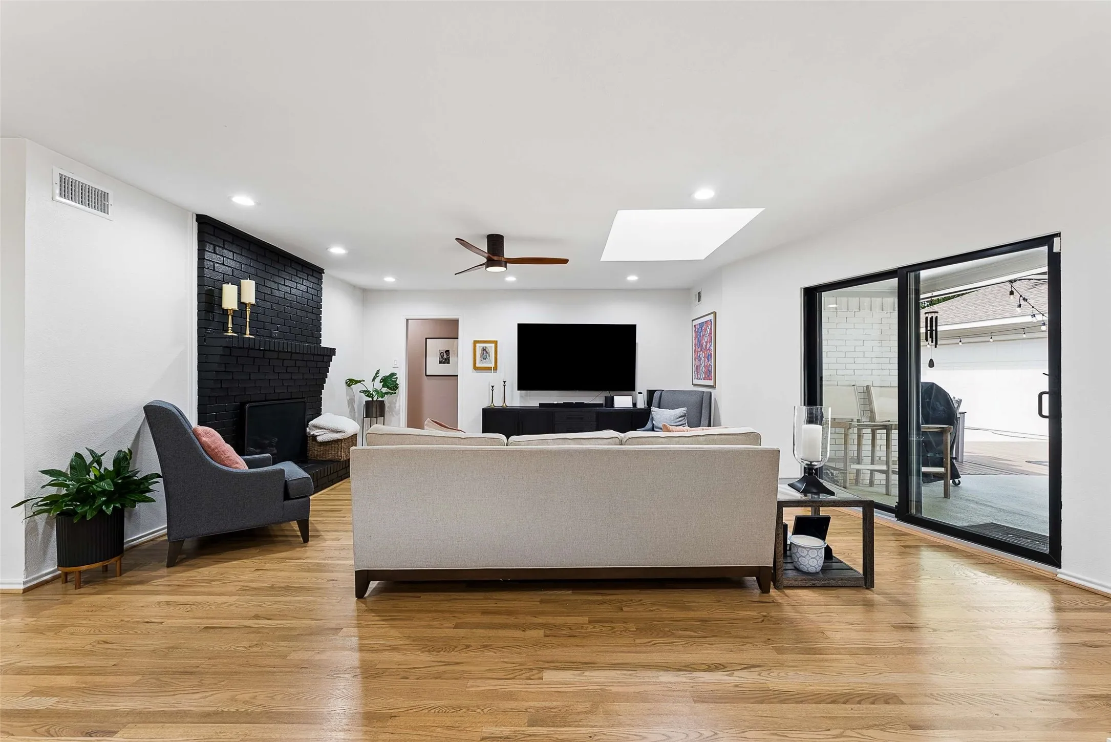 Family Room is the center of the house! Gas fireplace.  Sliding glass patio door and Skylight brings in tons of natural light!