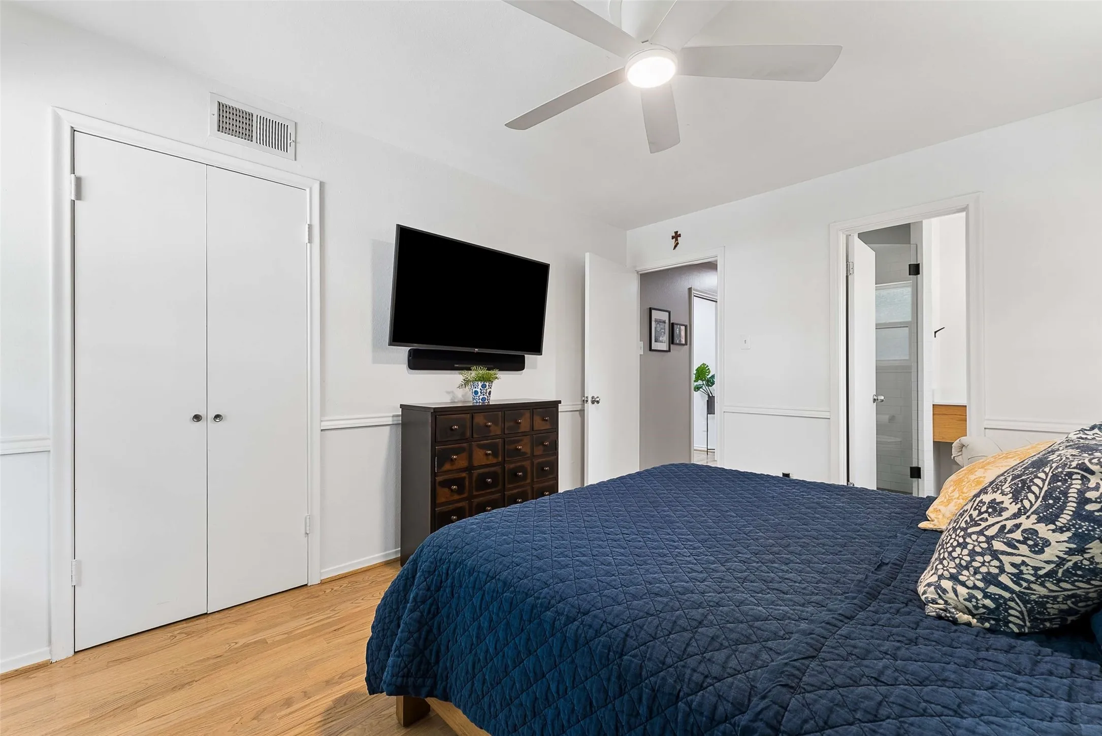 Bedroom 3. Back of house. Double doors it to the closet. Door to right is the ensuite bath with shower.
