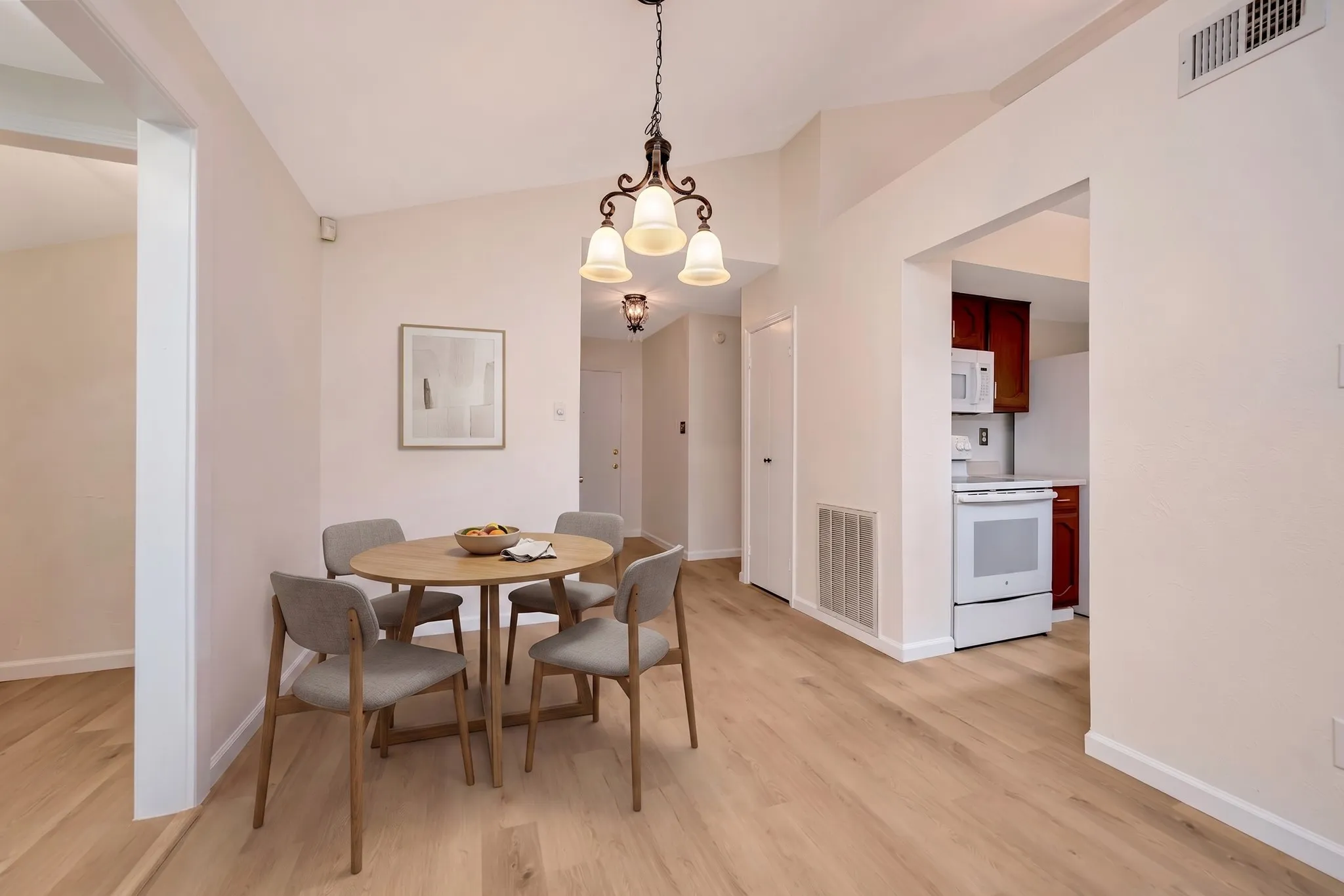 This is a virtually staged photo of the dining area.