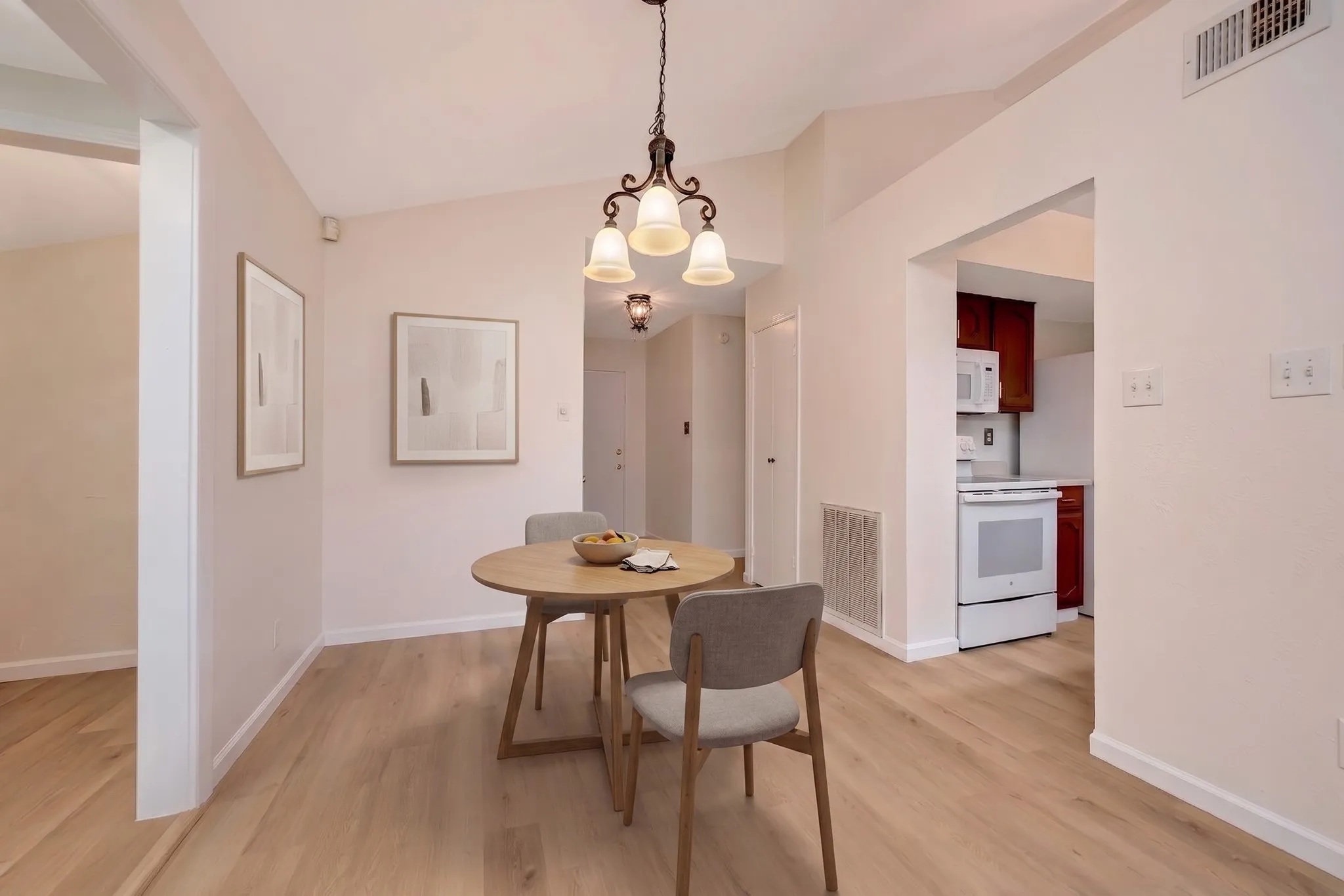 This is a virtually staged photo of the dining area.