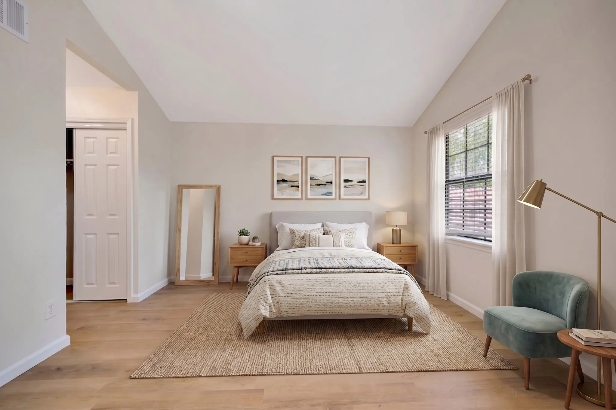 This is a virtually staged photo of the primary bedroom.