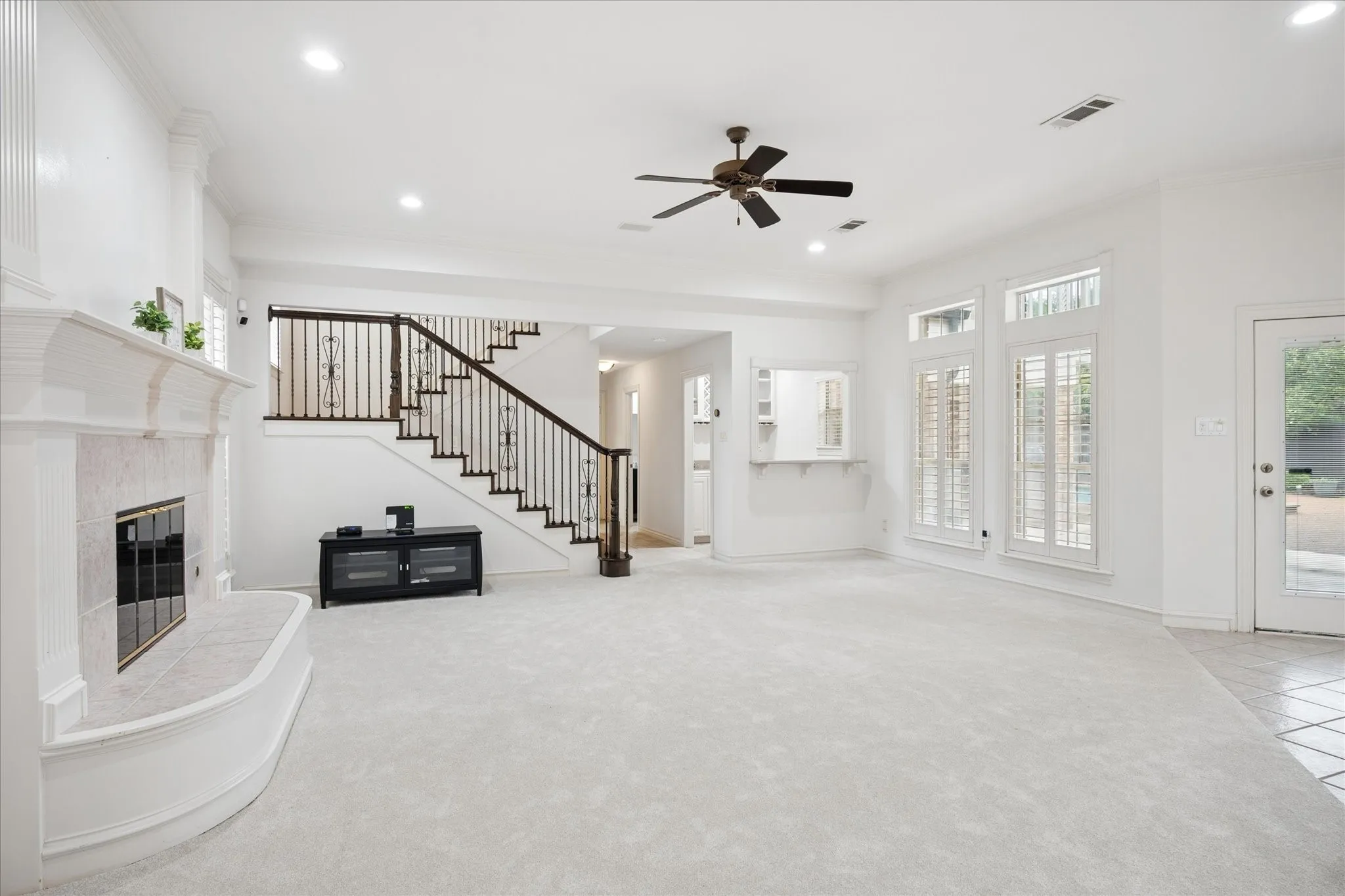 Living Room has access to the back patio and pool area