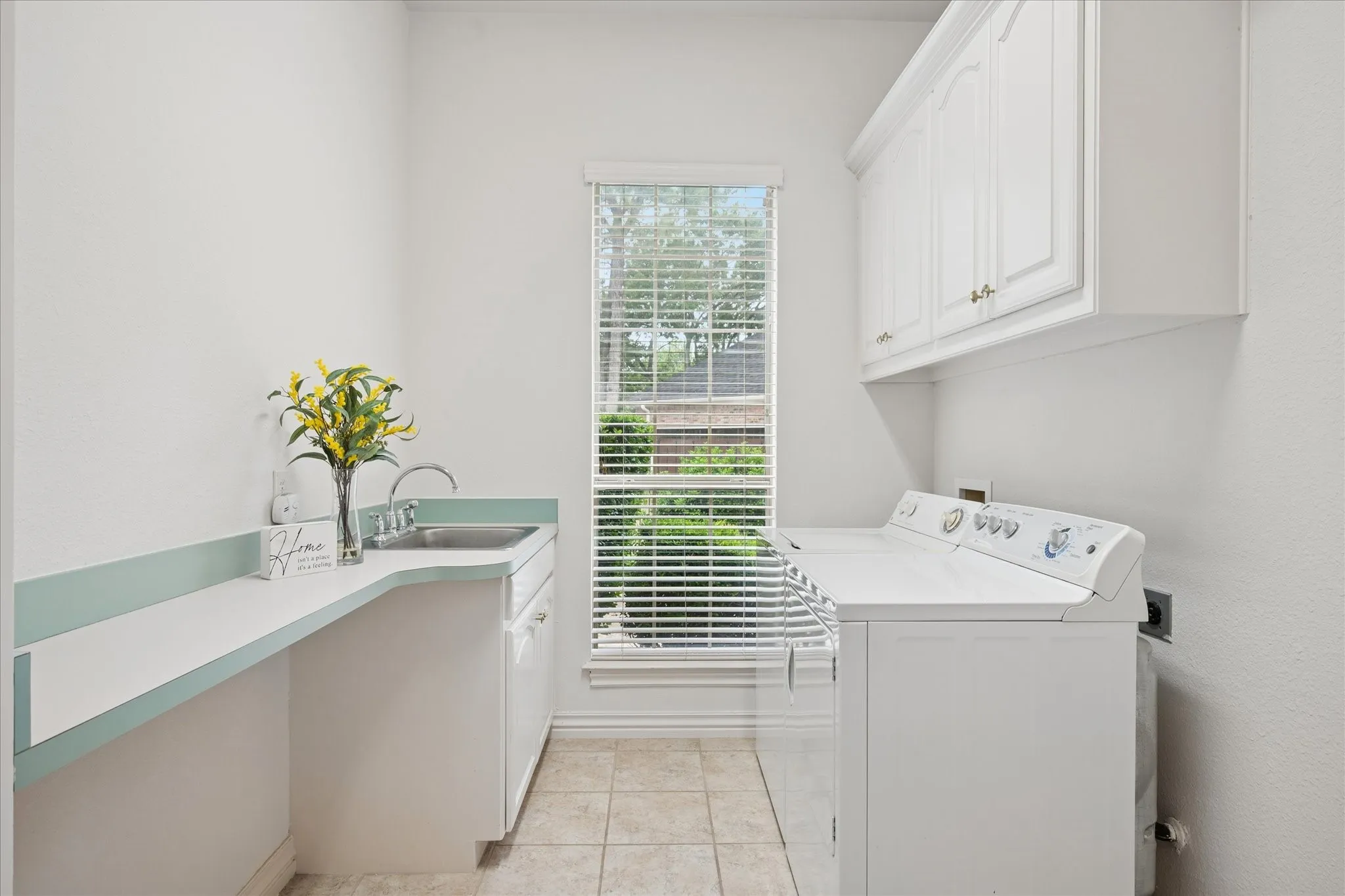 Laundry Room has lots of storage and counter-top space