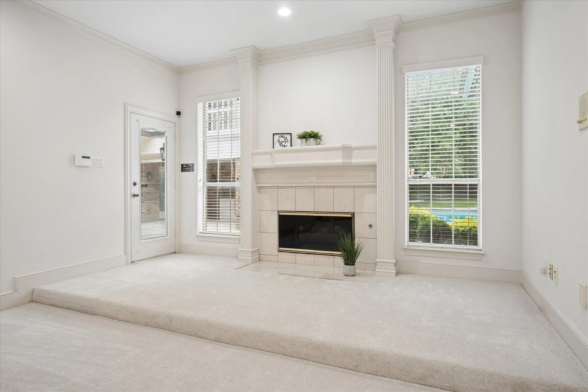 The primary bedroom also has access to the back patio and pool area