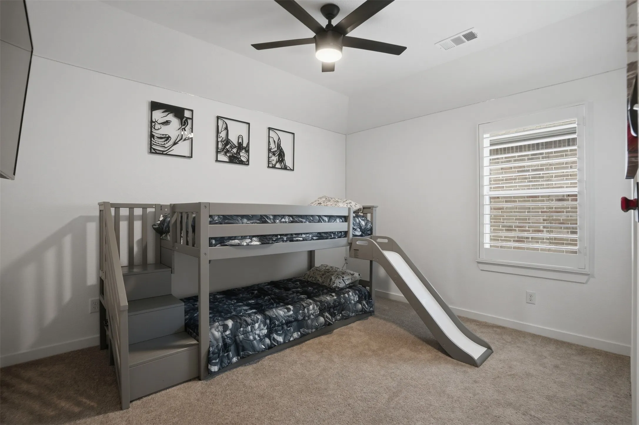  bedroom #2, located upstairs, Carpeted bedroom featuring a window with white plantation shutters, a ceiling fan with integrated lighting, and white baseboards
