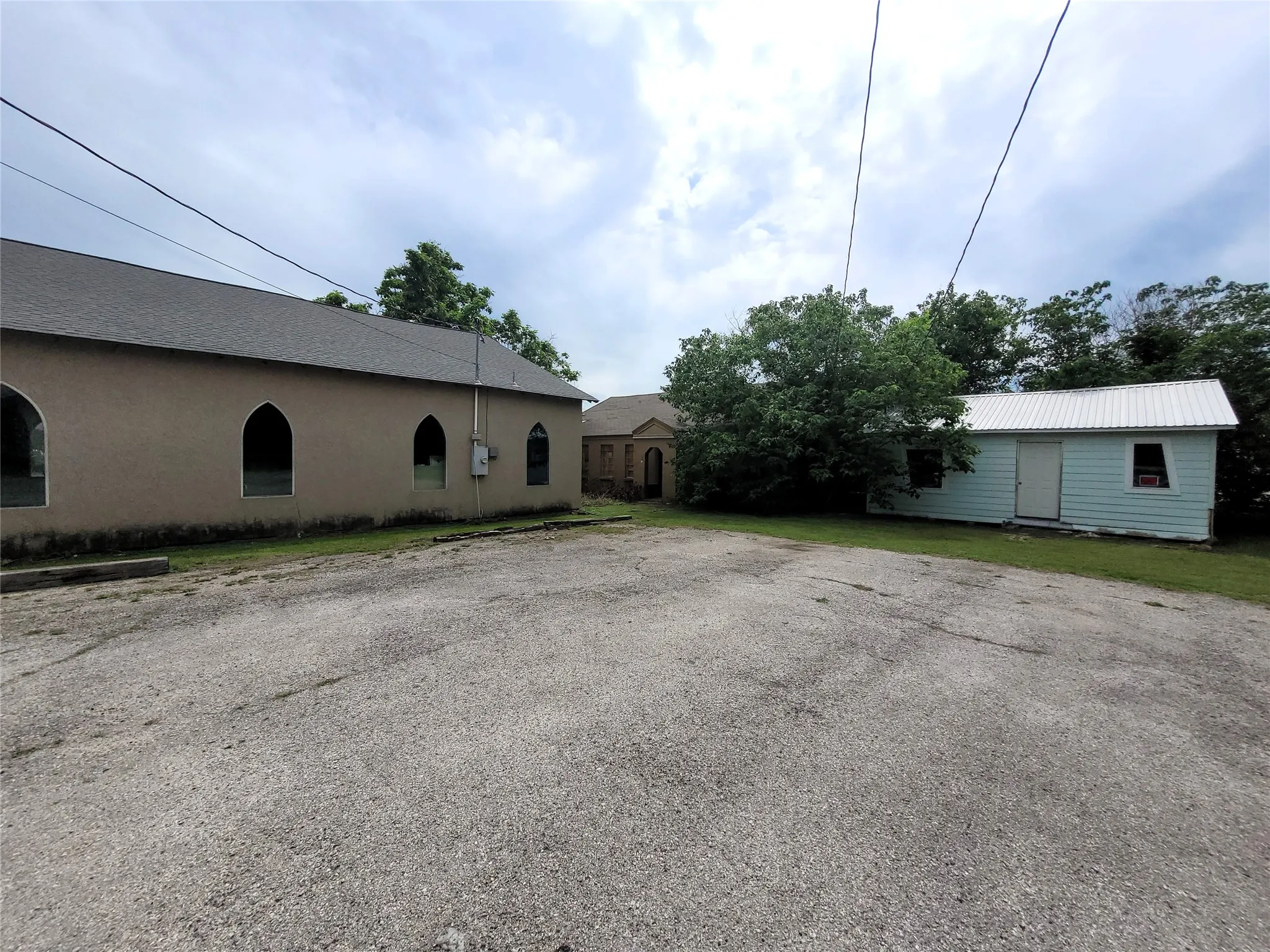 3 buildings total, including main office space, storage building, and back building.