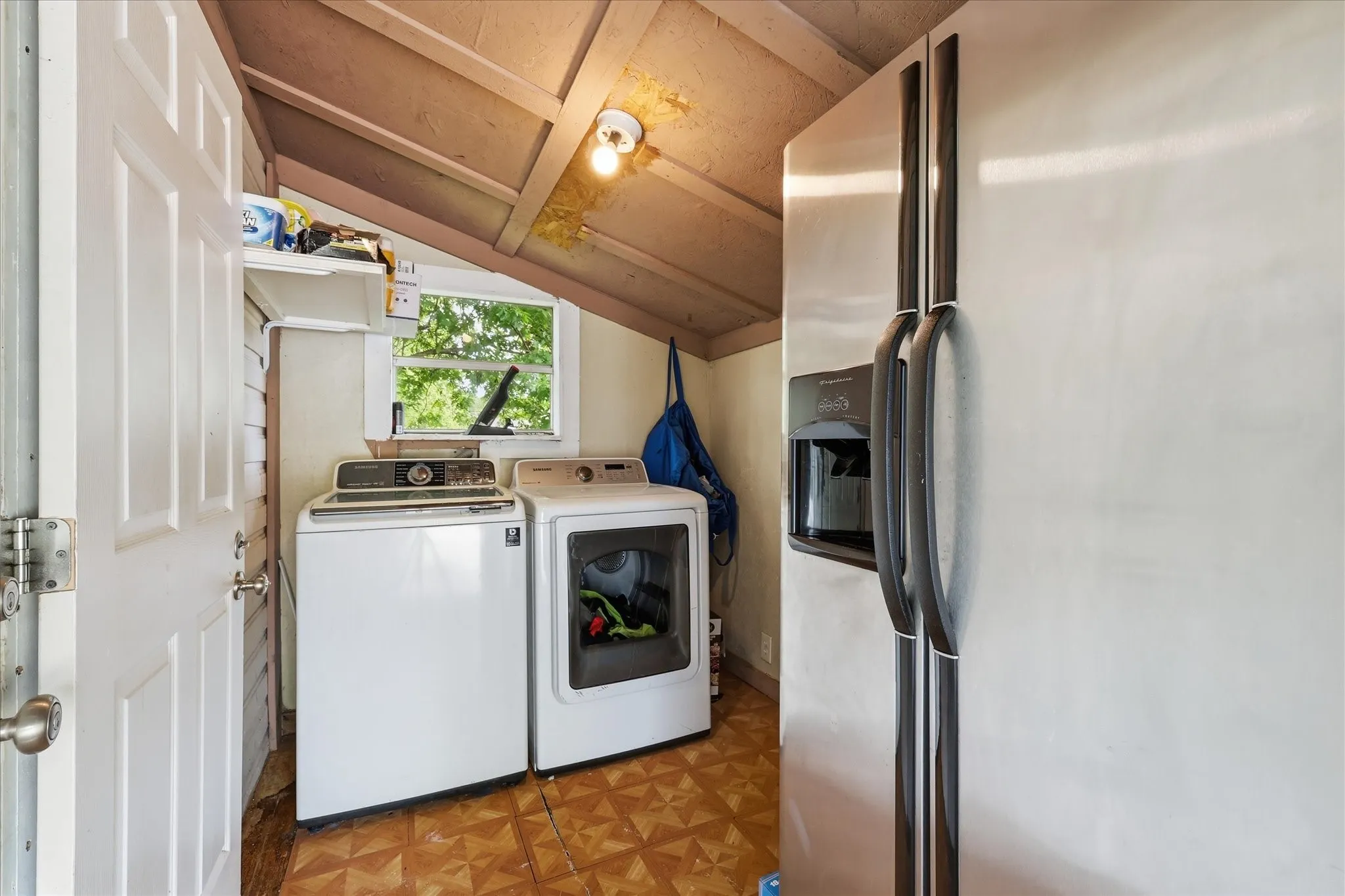 Laundry room off of the kitchen and carport