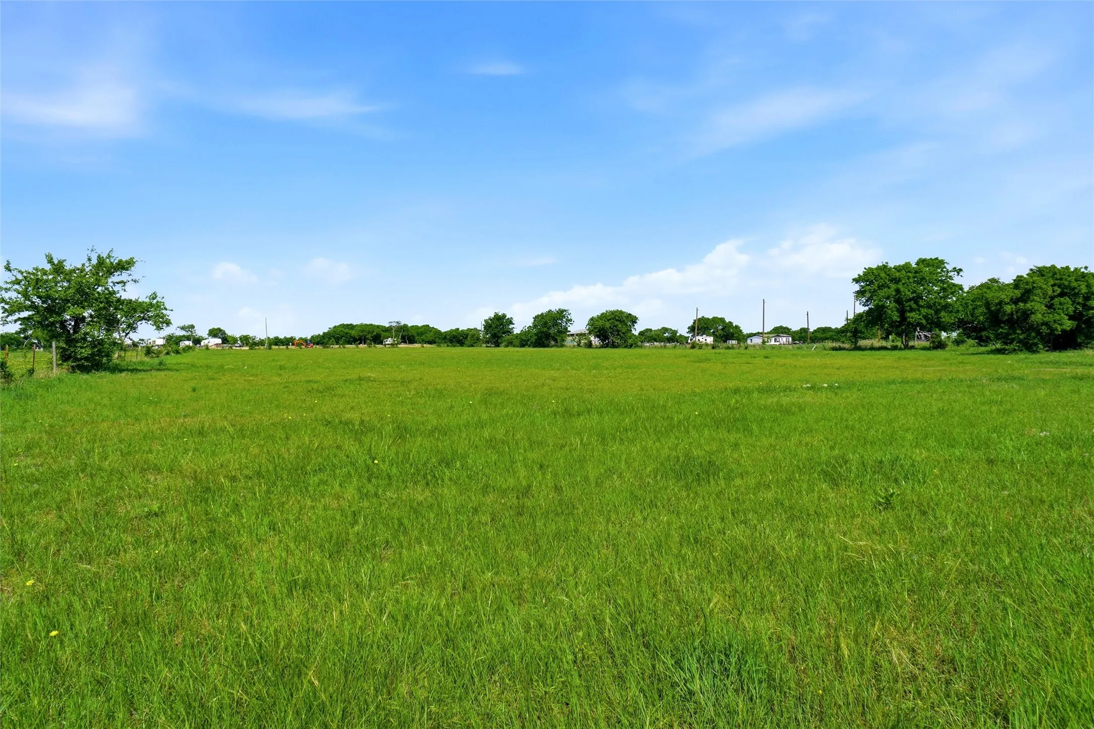 Bring your animals. This pasture grass is good grazing.  There are three sides with barbed wire  with a hot wire across the front.  Fencing may need to be added,depending on the animals.
