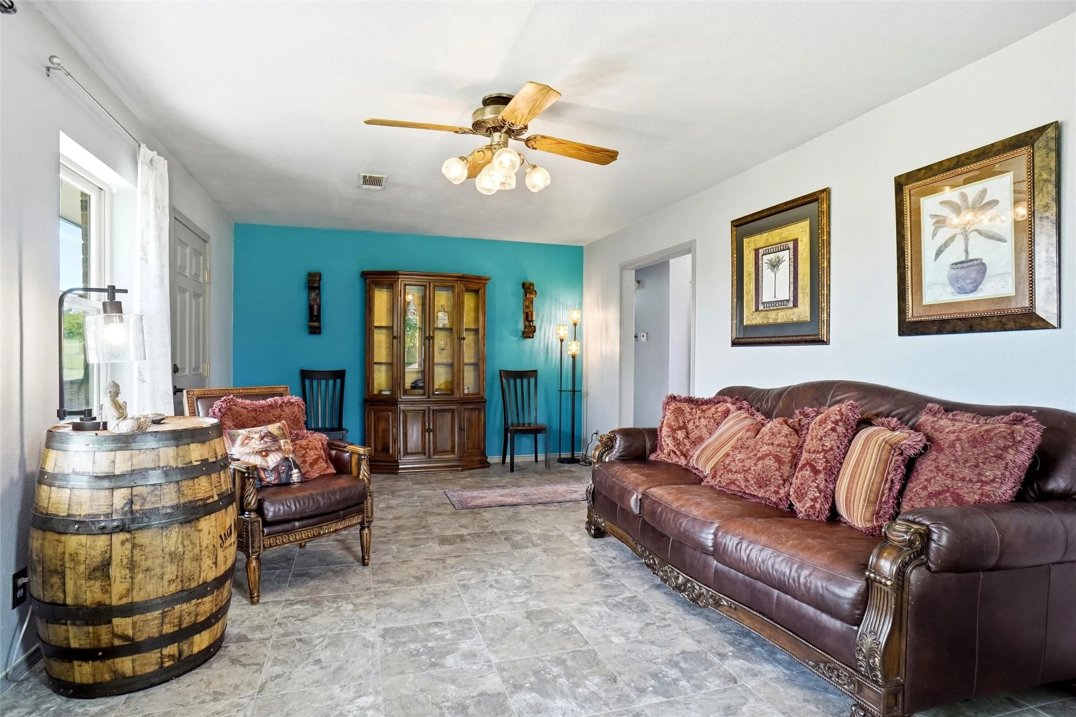Living room in house #1 with tile like laminate floors.