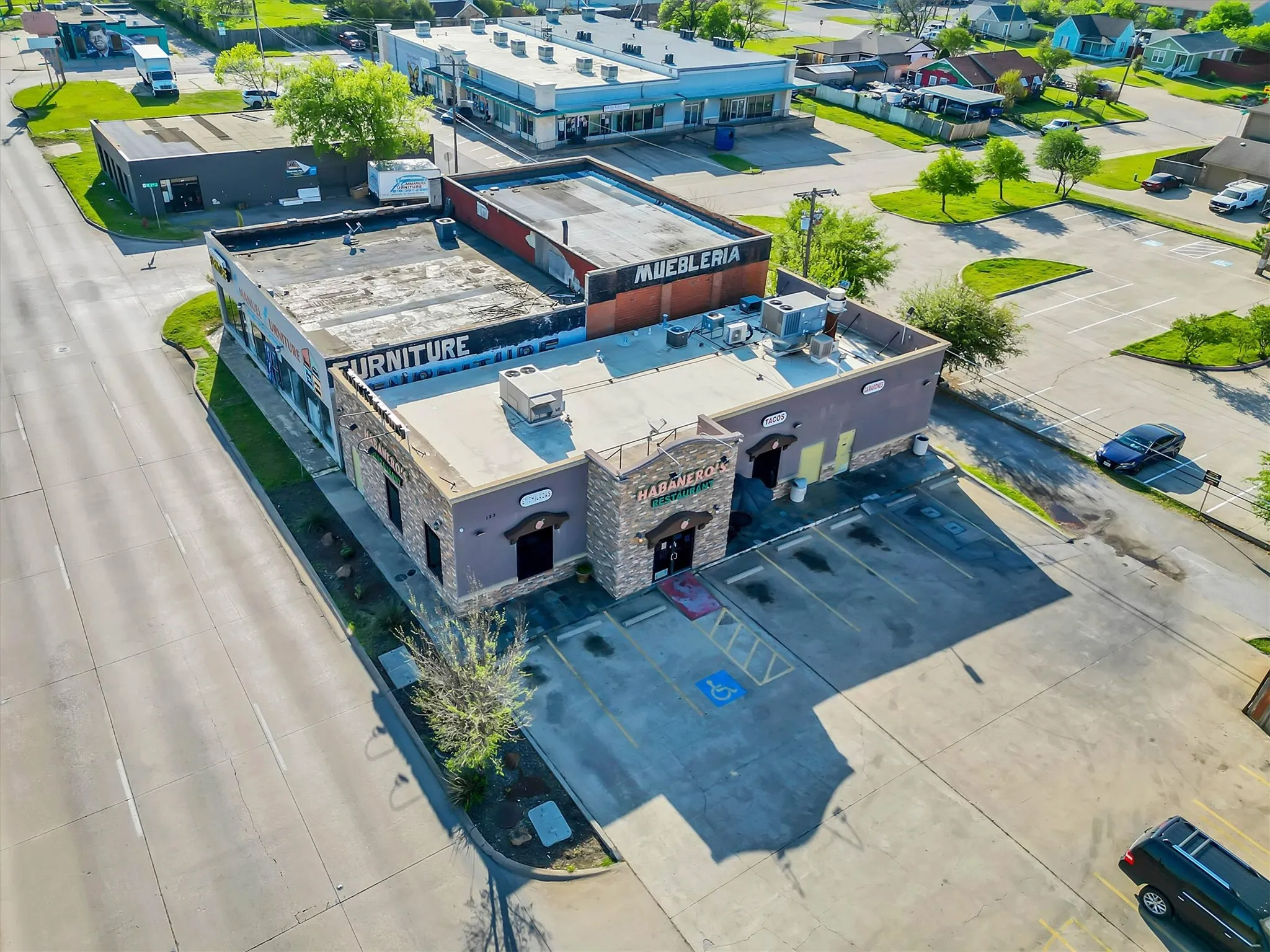 Commercial building with stone facade accents and dedicated parking lot