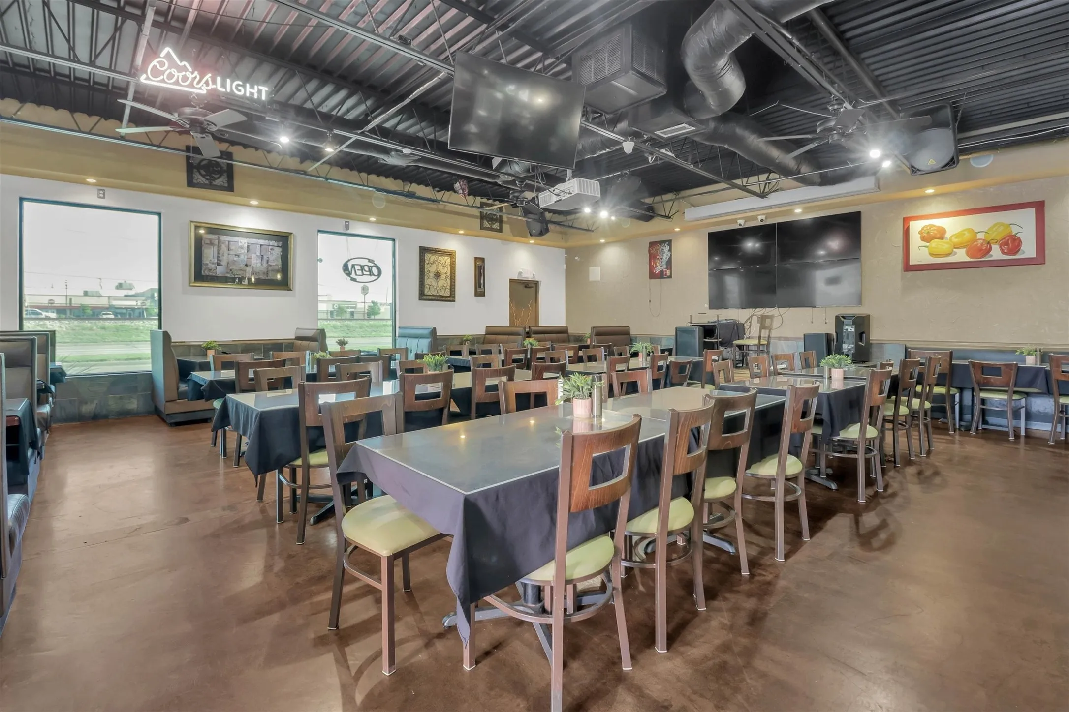 Expansive dining area featuring multiple seating configurations including booth and table arrangements