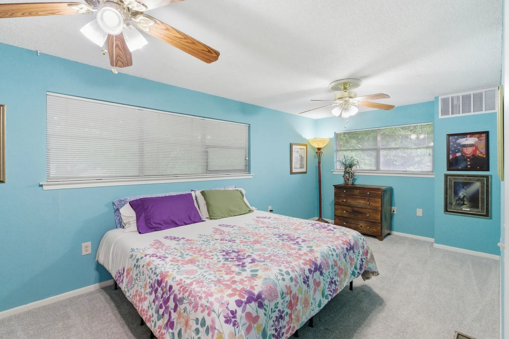 Room featuring soft blue walls and light gray carpet