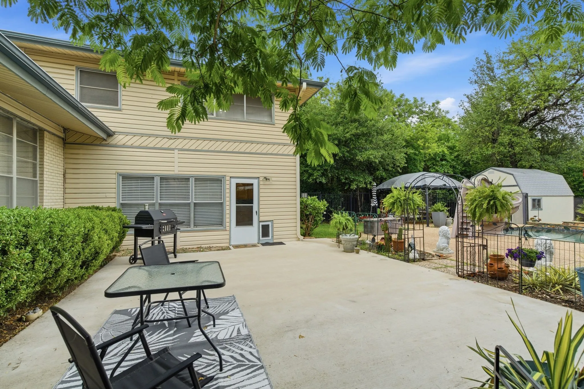 Expansive concrete patio offering direct access to the interior