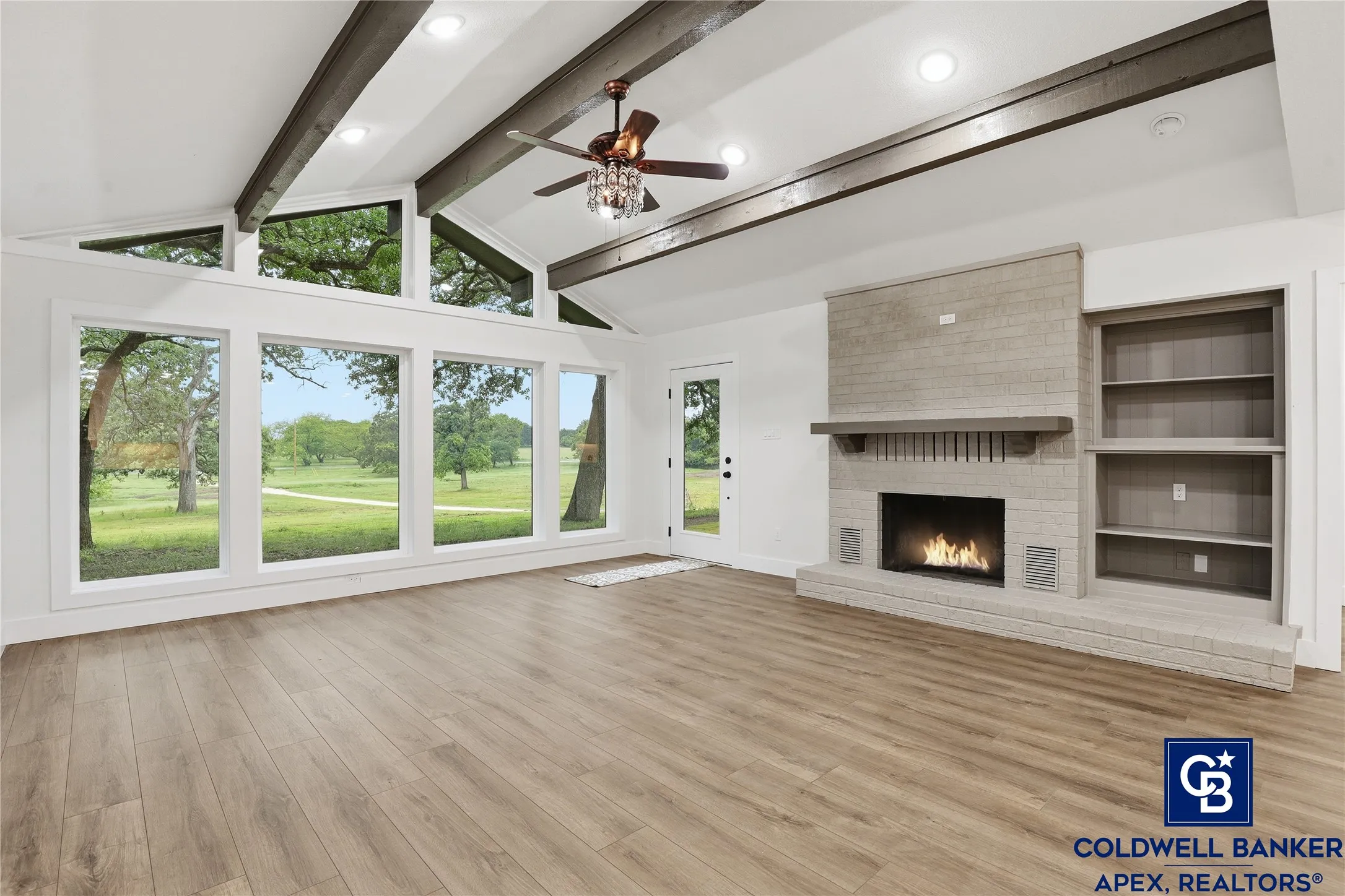 Spectacular picture floor-to-ceiling windows flood the home with natural light and frame incredible panoramic views of the acreage. Whether you’re entertaining or relaxing, this space is warm, inviting, and truly special.